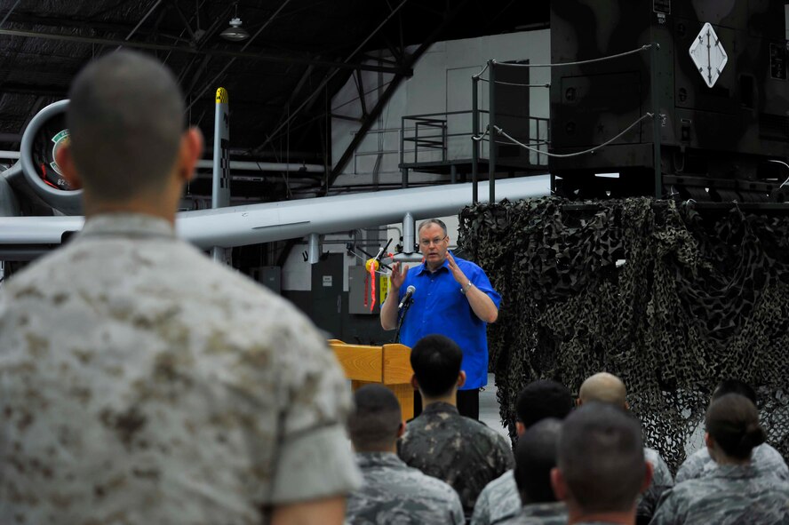 Deputy Secretary of Defense Bob Work answers a service member’s question asked during a troop event at Osan Air Base, Republic of Korea, Aug. 21, 2014. Work visited Osan for two days. (U.S. Air Force photo by Senior Airman David Owsianka/Released) 