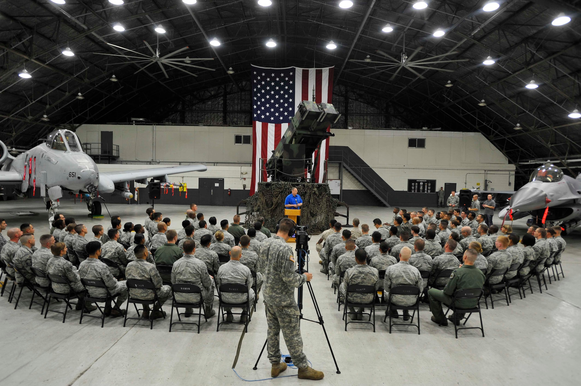 Deputy Secretary of Defense Bob Work talks to service members during a troop event at Osan Air Base, Republic of Korea, Aug. 21, 2014. Work then opened the floor to questions and coined Airmen after the event. (U.S. Air Force photo/Senior Airman David Owsianka)