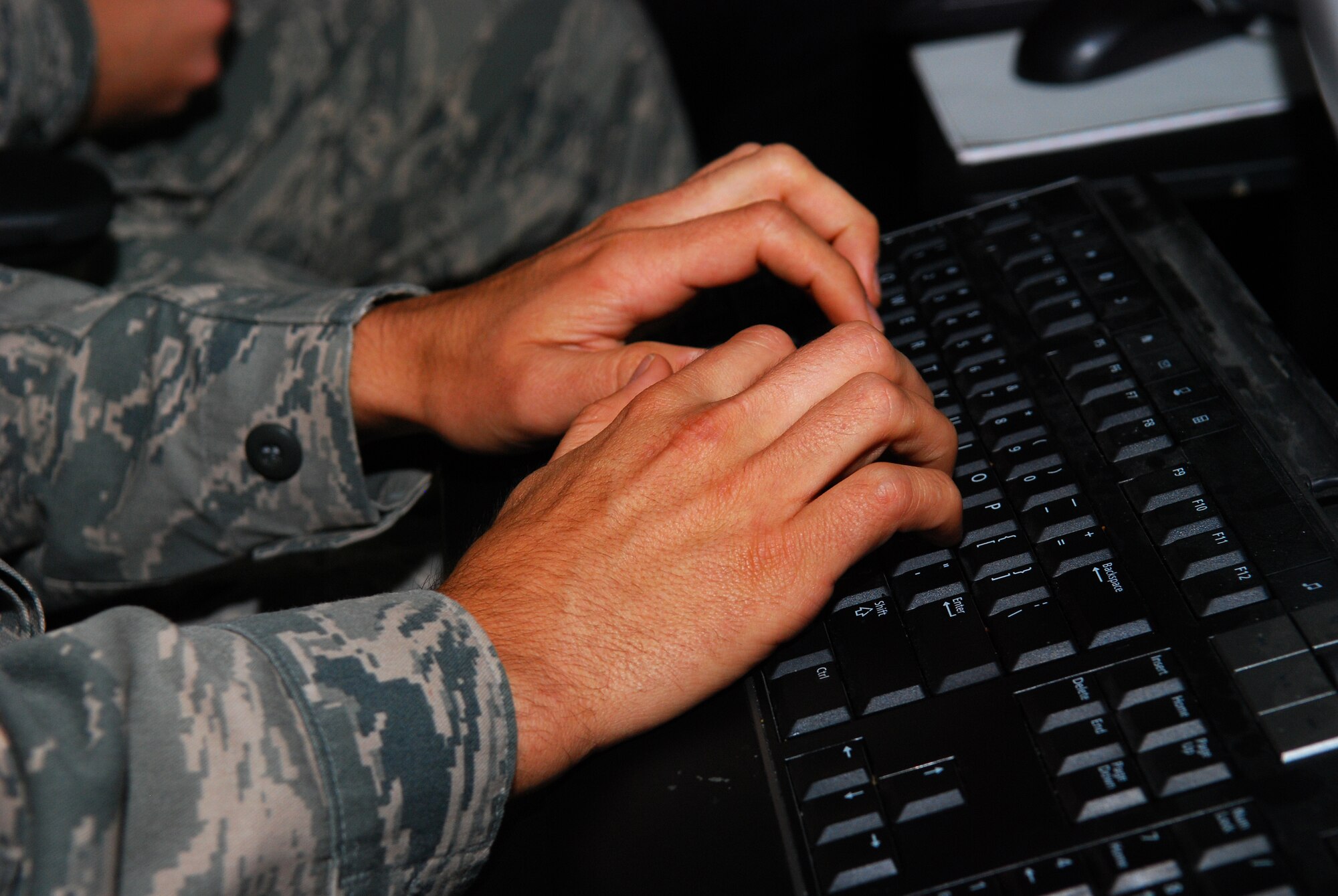 Service members utilize computer systems for operational work at the Harden Theater Air Control Center, Osan Air Base, South Korea, during Ulchi Freedom Guardian, Aug. 20, 2014. UFG provides an opportunity to evaluate, train and improve combined, joint coordination, procedures, plans and systems necessary for contingency operations by the Republic of Korea and U.S. forces. (U.S. Air Force photo by Senior Airman Racheal E. Watson/Released)
