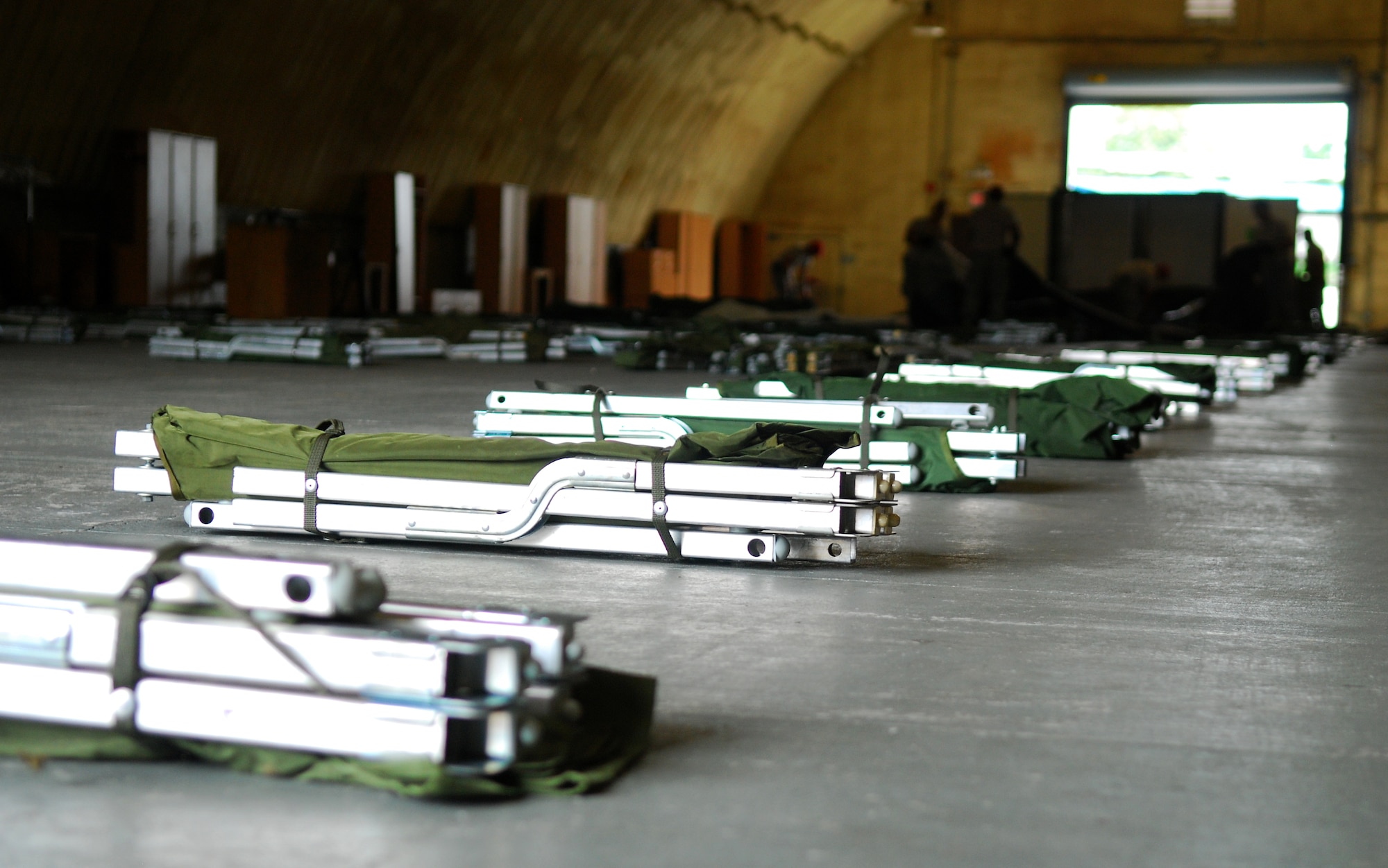 Cots line the floor of a K-Span at Rush Park, Osan Air Base, South Korea, during Ulchi Freedom Guardian, Aug. 18, 2014. Military personnel lived at Rush Park, an expeditionary-like community for exercise augmentees, for the duration of UFG. (U.S. Air Force photo by Senior Airman Racheal E. Watson/Released)