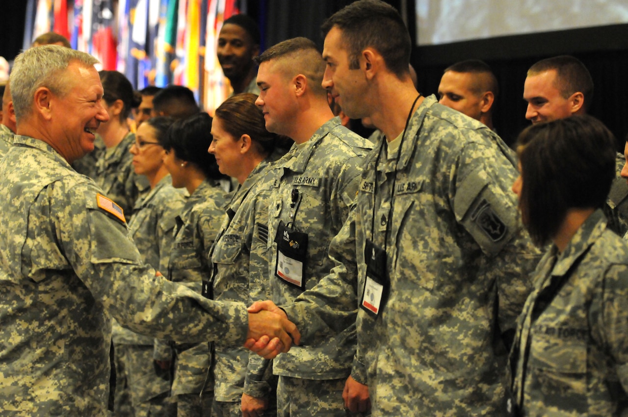 Army Gen. Frank J. Grass, chief of the National Guard Bureau, left, meets with service members at the Enlisted Association of the National Guard of the United States’ 43rd annual conference at the Phoenix Convention Center in downtown Phoenix, Ariz., Aug. 11, 2014. The conference enabled Grass and other senior leaders to speak directly to Guard members and answer questions the enlisted force. Air National Guard photo by Air Force Tech. Sgt. David Eichaker
