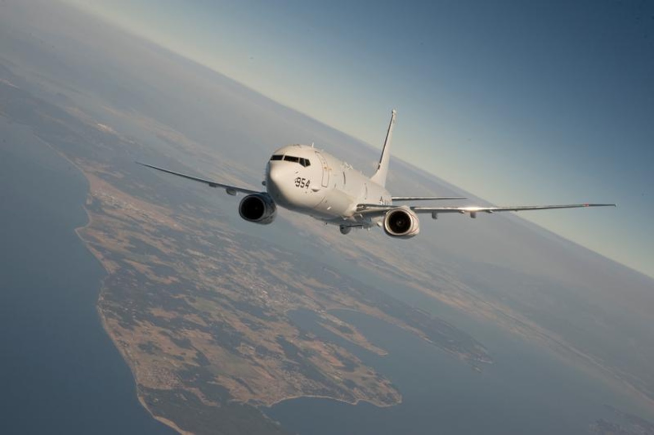 A U.S. Navy P-8 Poseidon in flight. According to the Defense Department, a U.S. aircraft of the same type on a routine mission flying in the Pacific Ocean region was “buzzed” Aug. 19 by a Chinese fighter jet about 135 miles east of Hainan Island in international airspace. U.S. Navy photo