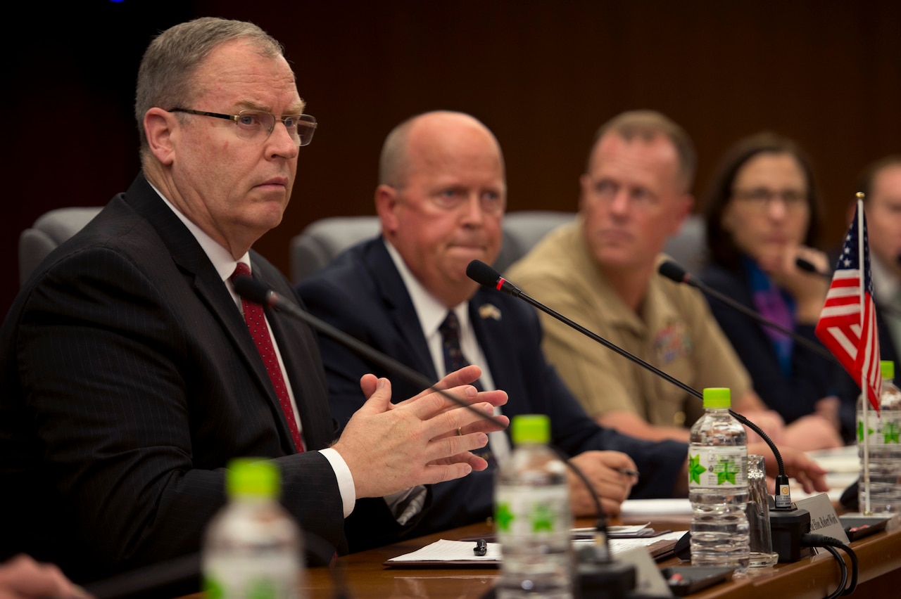 U.S. Deputy Defense Secretary Bob Work, left, attends a meeting hosted by Japanese Senior Vice Defense Minister Ryota Takeda during a visit to Tokyo, Aug. 22, 2014. During the meeting, defense leaders discussed U.S. and Japanese partnerships as part of efforts to bolster security and stability in the Asia-Pacific region. DoD photo by U.S. Air Force Master Sgt. Adrian Cadiz