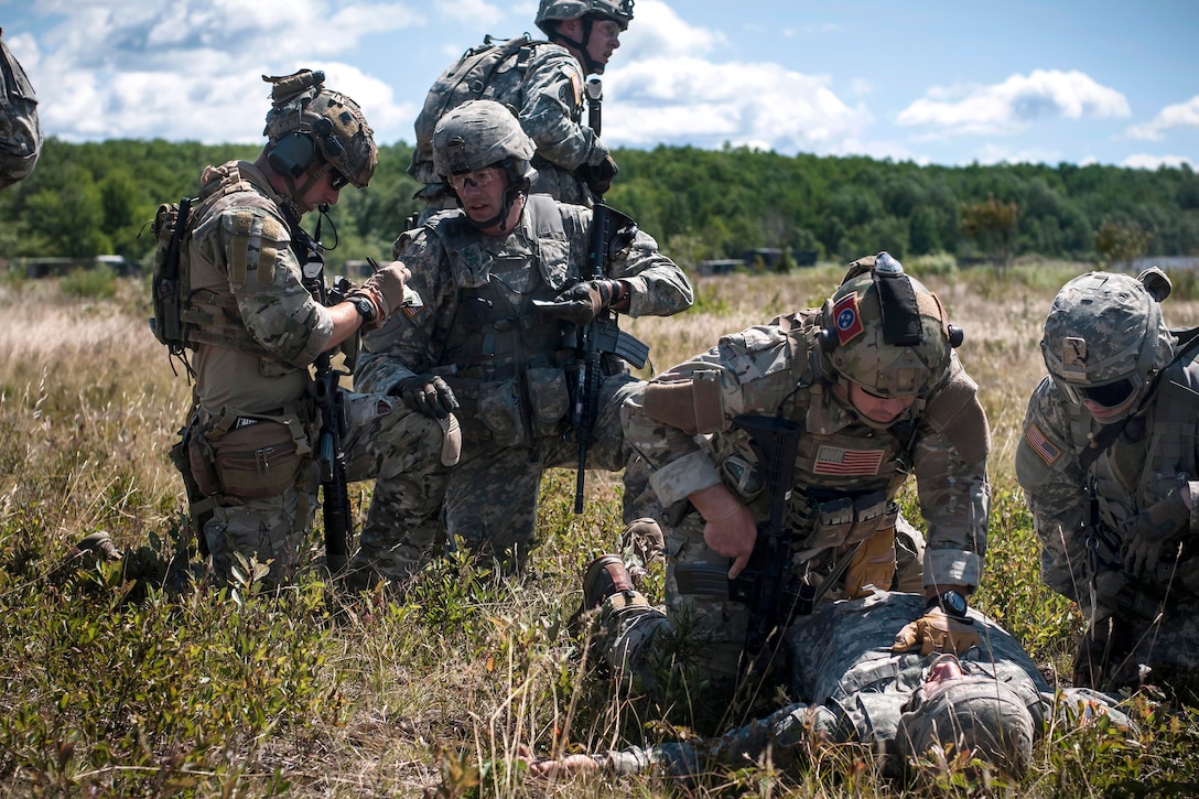 Airmen and soldiers respond to a wounded solider and request medical ...