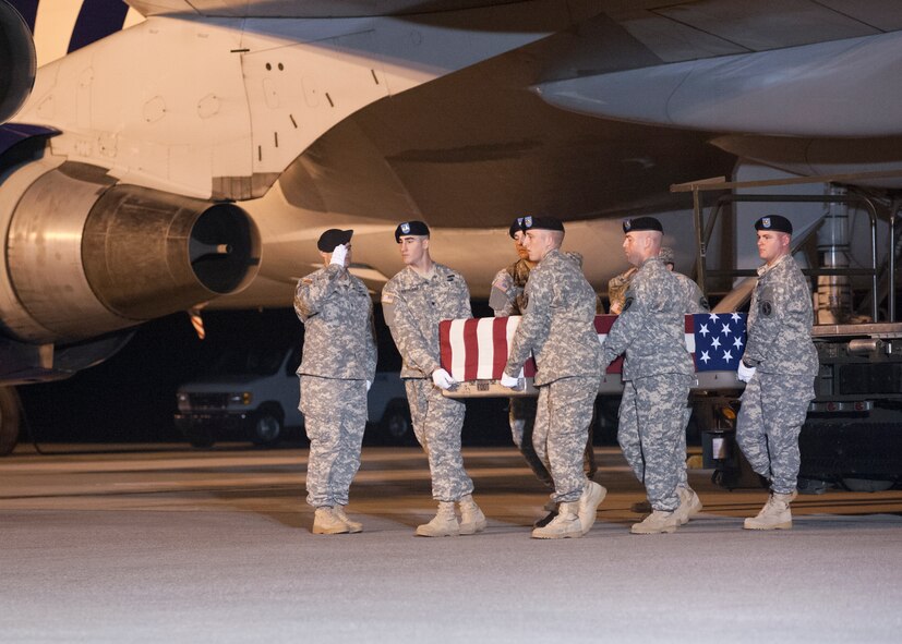 A U.S. Army carry team transfers the remains of Sgt. Christopher W. Mulalley of Eureka, Calif., at Dover Air Force Base, Del. Mulalley was assigned to Troop B, 1st Squadron, 3rd Cavalry at Fort Hood, Texas. (U.S. Air Force photo/Senior Airman Jared Duhon)
