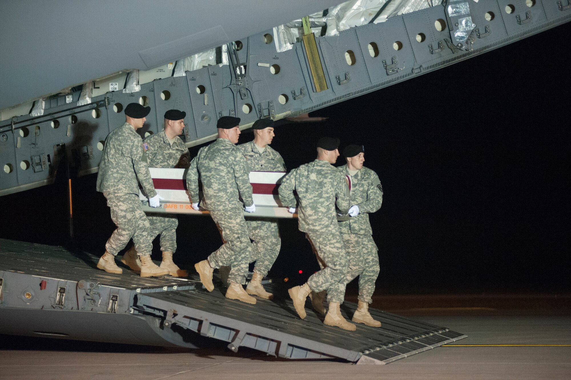 A U.S. Army carry team transfers the remains of Sgt. 1st Class Matthew I. Leggett of Ruskin, Fla., during a dignified transfer Aug. 23, 2014 at Dover Air Force Base, Del. Leggett was assigned to Headquarters and Headquarters Battalion, XVIII Airborne Corps, Fort Bragg, N.C. (U.S. Air Force photo/Senior Airman Jared Duhon)
