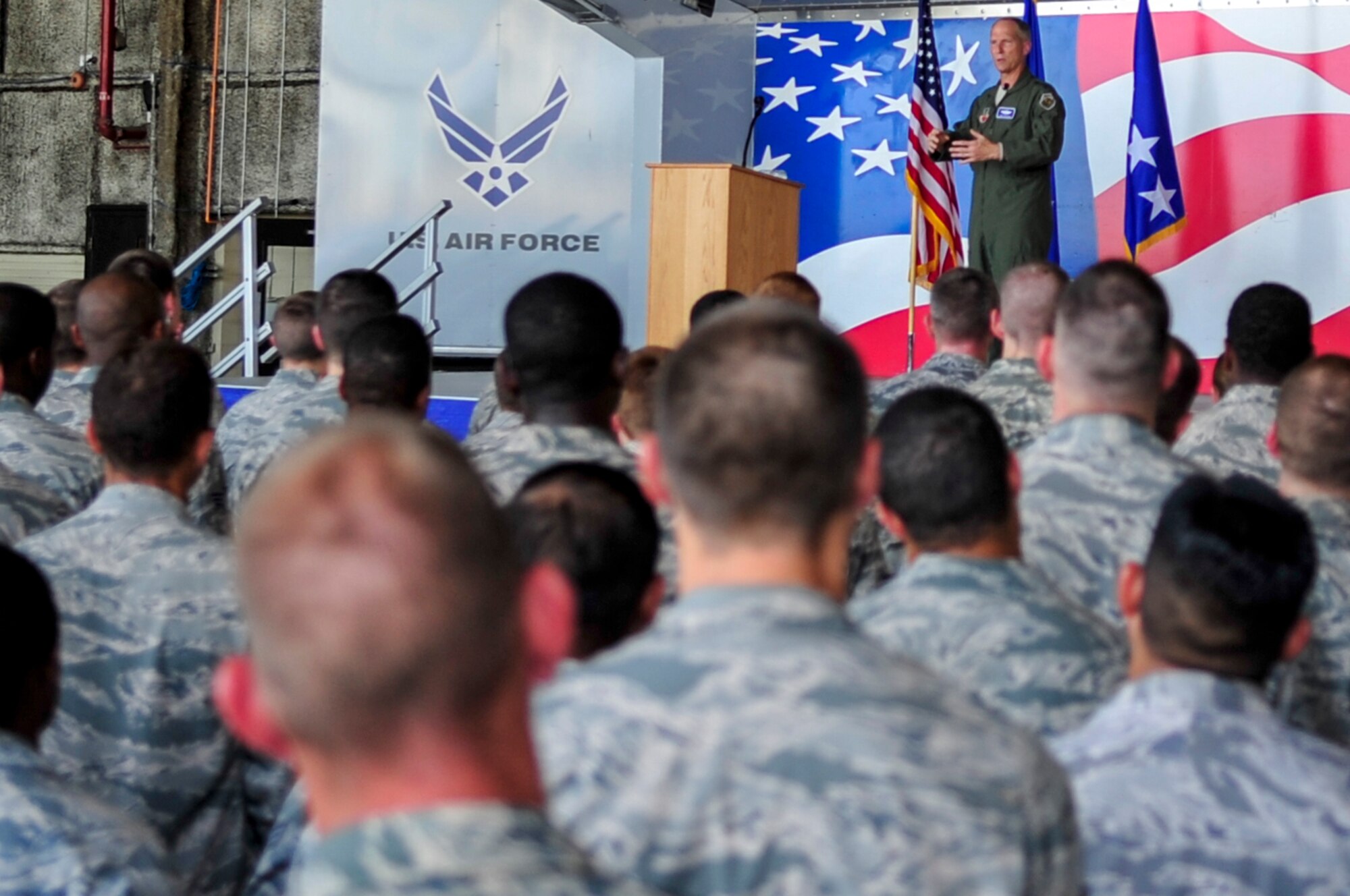 U.S. Air Force Gen. Mike Hostage, commander of Air Combat Command, talks to 4th Fighter Wing Airmen during an all-call at Seymour Johnson Air Force Base, North Carolina, Aug. 21. During the all-call, Hostage emphasized that the mission of ACC is to provide combat airpower to America's warfighters. (U.S. Air Force photo by Airman 1st Class Shawna Keyes/Released)
