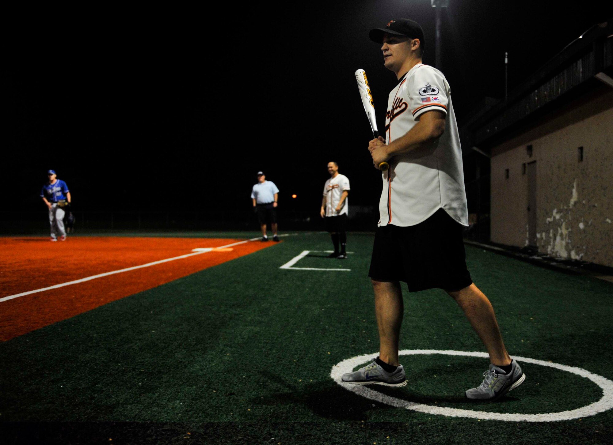 John Jenkins, 51st Operations Support Squadron, walks to the plate during the fifth inning of the intramural softball championship game on Osan Air Base, Republic of Korea, Aug. 21, 2014. Jenkins grounded out during his at bat. (U.S. Air Force photo/Senior Airman David Owsianka)