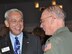 Mr. Jim Wallace, 514th Air Mobility Wing honorary commander, laughs with Col. Michael J. Underkofler, 514th Air Mobility Wing commander during the Joint Base Honorary Commanders Induction ceremony held here Aug. 20. The Honorary Commanders program encourages an exchange of ideas, experiences and friendships between key leaders of the surrounding communities and JB MDL. In addition, it is an opportunity for commanders and community leaders to positively impact community and base interaction by building and strengthening community relationships (U.S. Air Force photo/Tech. Sgt. Jonathan E. White).