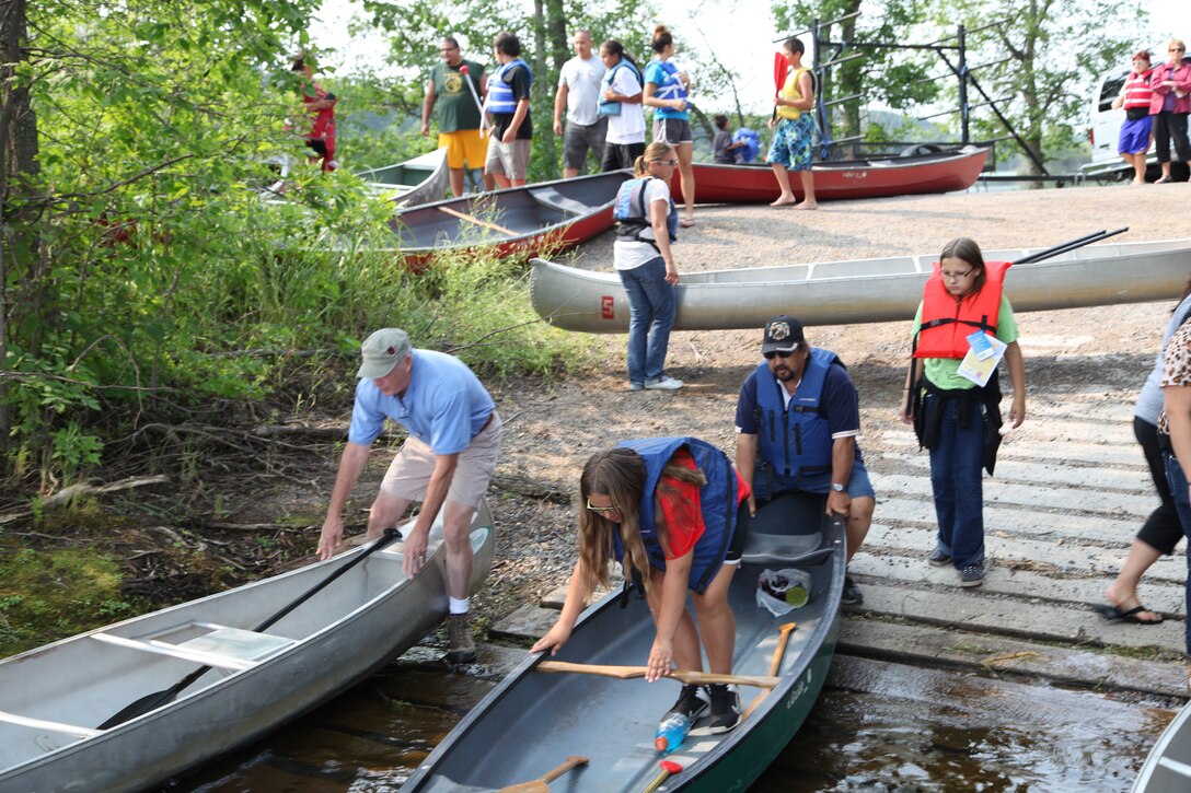 Participants in the annual Mikwendaagoziwag ceremony at our Sandy Lake Recreation Area prepare their canoes.
