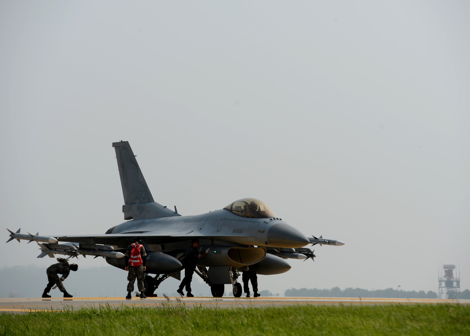 Republic of Korea Air Force F-16 Fighting Falcons from the 111th Fighter Squadron land at Kunsan Air Base, Republic of Korea, after a training mission Aug. 22, 2014. The ROKAF works with the 8th Operations Support Group to train, support and defend the region. (U.S. Air Force photo by Senior Airman Justyn M. Freeman/Released)