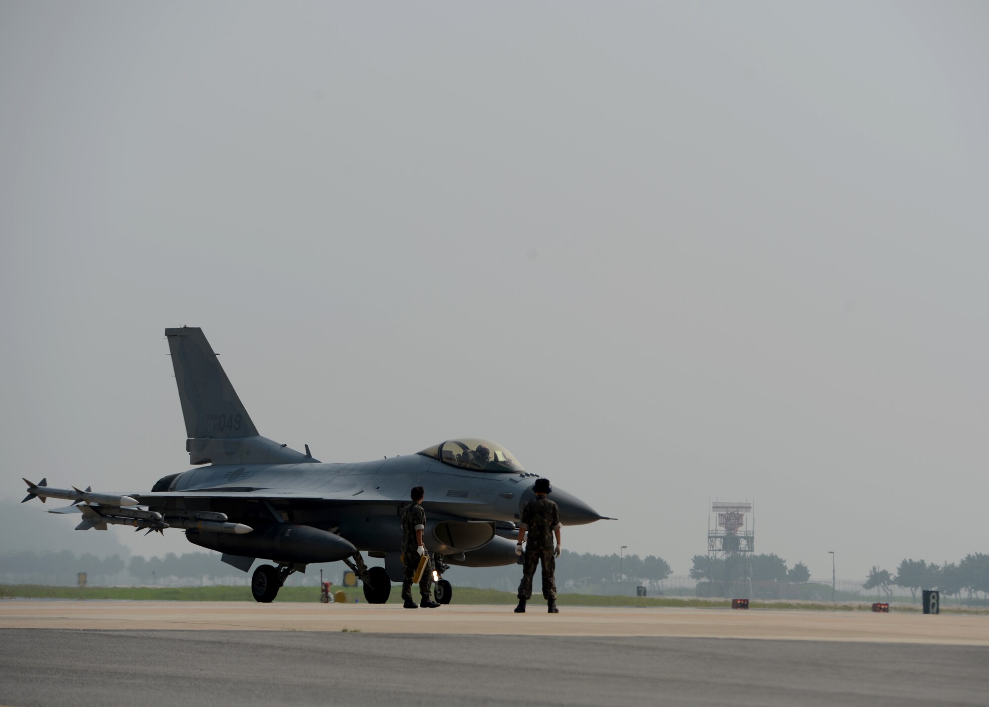 Republic of Korea Air Force F-16 Fighting Falcons from the 111th Fighter Squadron land at Kunsan Air Base, Republic of Korea, after a training mission Aug. 22, 2014. The ROKAF works with the 8th Operations Support Group to train, support and defend the region. (U.S. Air Force photo by Senior Airman Justyn M. Freeman/Released)