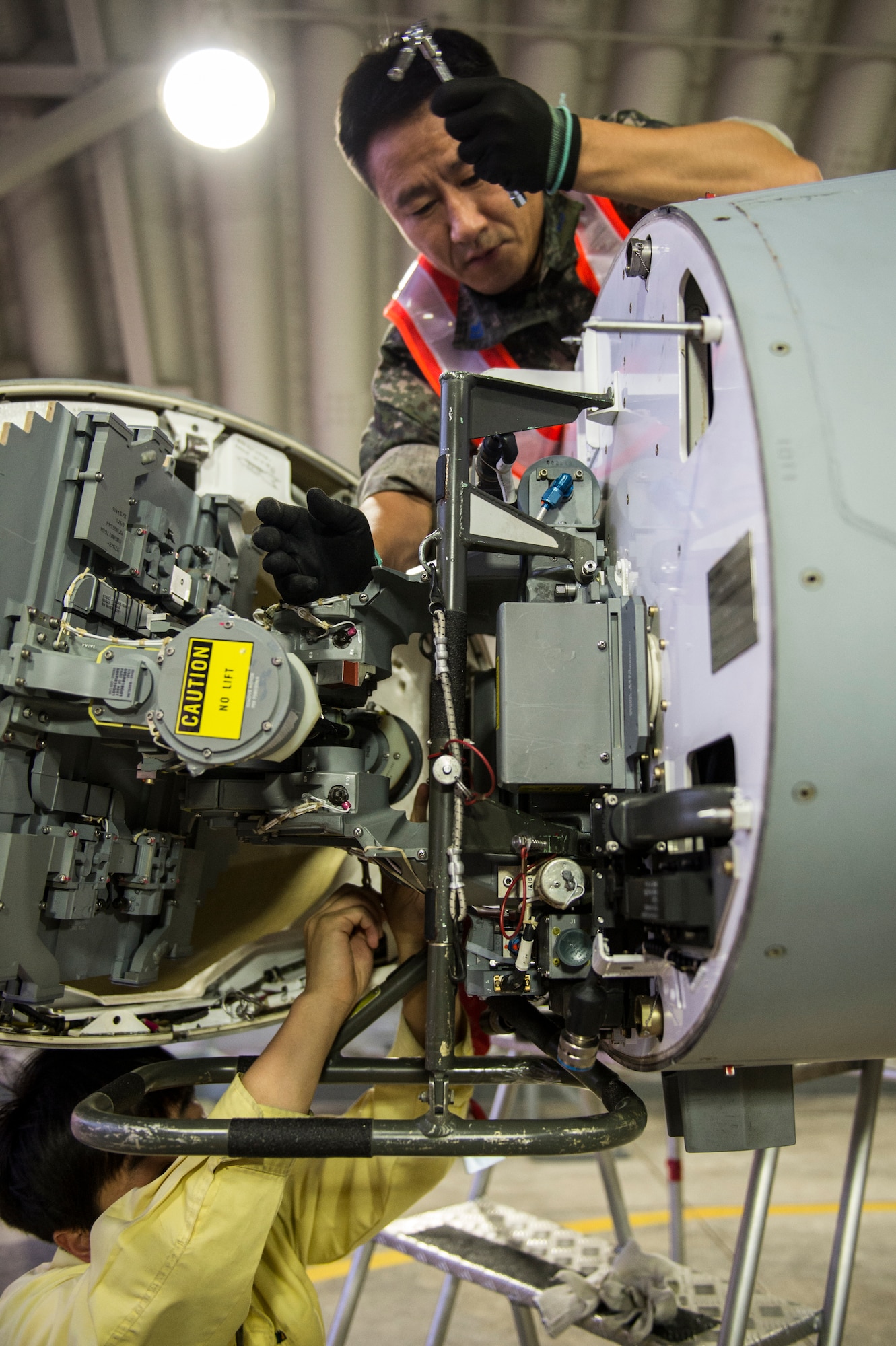 Republic of Korea Air Force F-16 Fighting Falcon maintainers from the 111th Fighter Squadron prepare the aircraft for a training mission at Kunsan Air Base, Republic of Korea, before a training mission Aug. 22, 2014. The ROKAF works with the 8th Operations Support Group to train and defend the region. (U.S. Air Force photo by Staff Sgt. Stephany Richards/ Released)