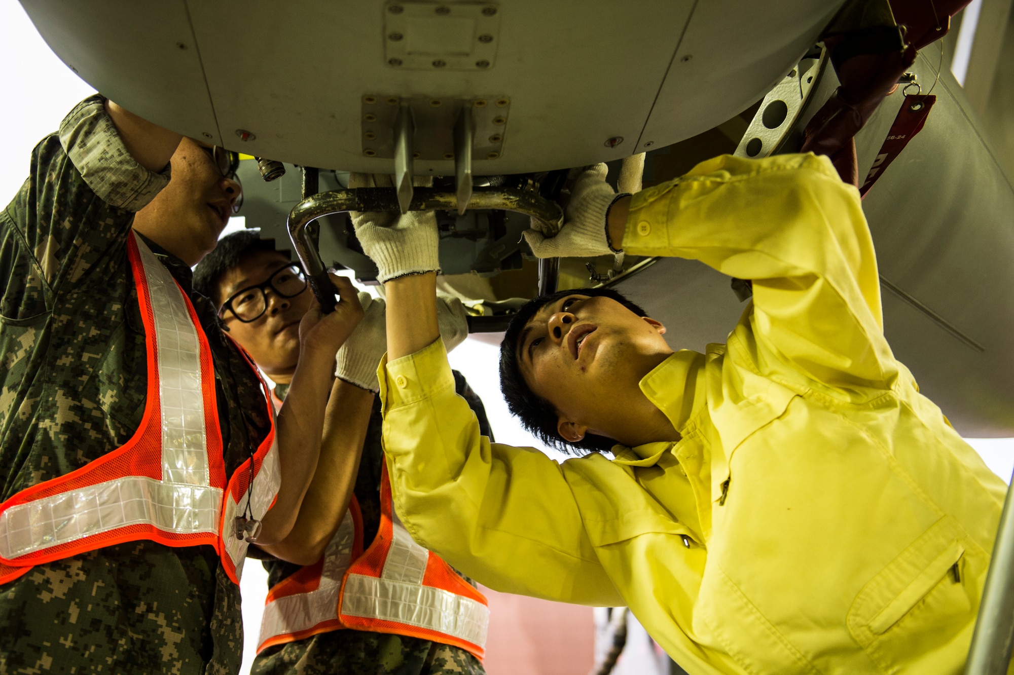 Republic of Korea Air Force F-16 Fighting Falcon maintainers from the 111th Fighter Squadron prepare the aircraft for a training mission at Kunsan Air Base, Republic of Korea, before a training mission Aug. 22, 2014. The ROKAF works with the 8th Operations Support Group to train and defend the region. (U.S. Air Force photo by Staff Sgt. Stephany Richards/ Released)