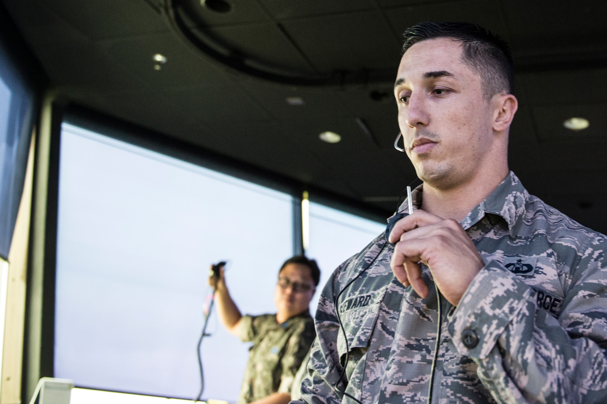 U.S. Air Force Staff Sgt. Kyle Steward, 8th Operations Support Squadron aircraft tower control watch supervisor, talks to aircraft approaching the airfield at Kunsan Air Base, Republic of Korea, Aug. 21, 2014.  The 8th OSS is the backbone of the 8th Operations Group, providing the aircrews the support they need to keep on flying. (U.S. Air Force photo by Staff Sgt. Stephany Richards/ Released)
