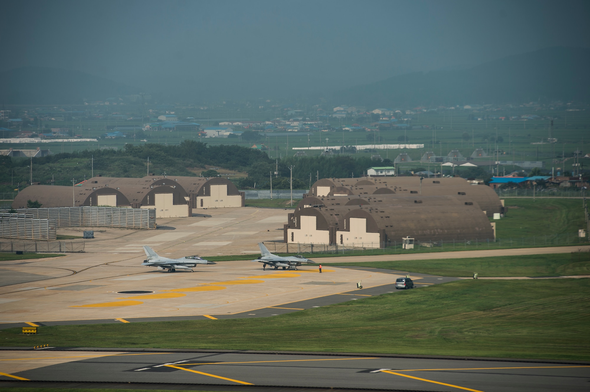 Republic of Korea Air Force F-16 Fighting Falcons from the 111th Fighter Squadron land at Kunsan Air Base, Republic of Korea, after a training mission Aug. 22, 2014. The ROKAF works with the U.S. Air Force’s 8th Operations Support Group to train and defend the region. (U.S. Air Force photo by Staff Sgt. Stephany Richards/ Released)