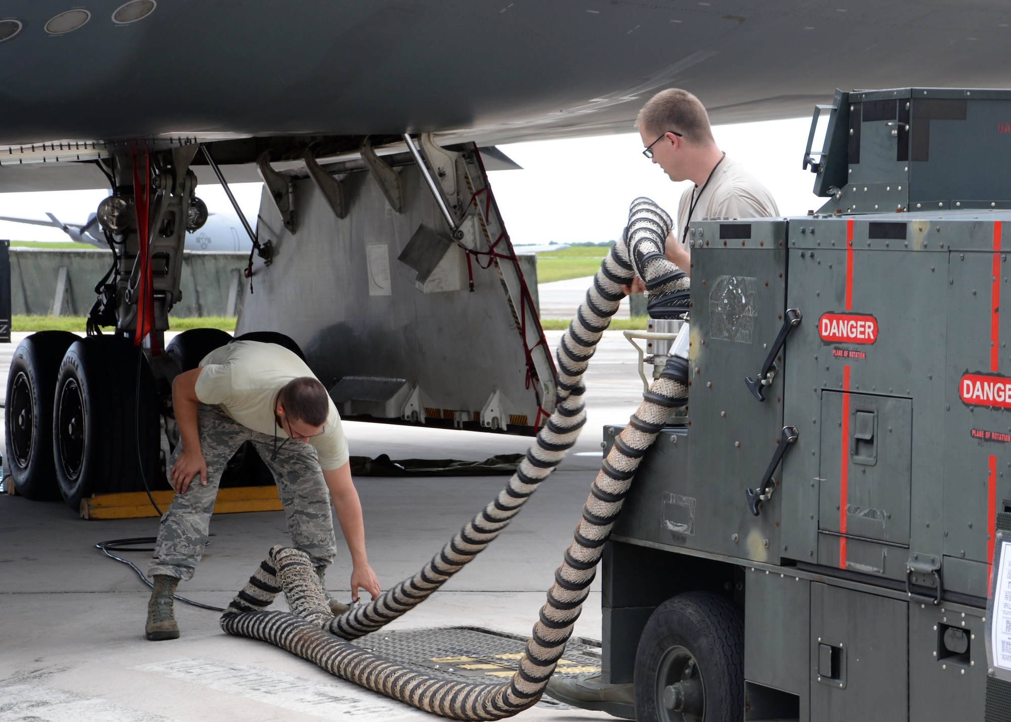Airmen from the 509th Aircraft Maintenance Squadron work on a B-2 Spirit bomber during a deployment, Andersen Air Force Base, Guam, Aug. 22, 2014.The bombers and approximately 200 support Airmen, assigned to the 509th Bomb Wing at Whiteman Air Force Base, Mo., deployed to Guam Aug. 6, 2014 to improve combat readiness and ensure regional stability.  Bomber deployments help maintain stability in the region while allowing units to become familiar with operating in the theater according to USPACOM.  (U.S. Air Force photo by Senior Airman Cierra Presentado/Released)