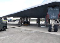 Airmen from the 509th Aircraft Maintenance Squadron work on a B-2 Spirit bomber during a deployment, Andersen Air Force Base, Guam, Aug. 22, 2014.The bombers and approximately 200 support Airmen, assigned to the 509th Bomb Wing at Whiteman Air Force Base, Mo., deployed to Guam Aug. 6, 2014 to improve combat readiness and ensure regional stability.  Bomber deployments help maintain stability in the region while allowing units to become familiar with operating in the theater according to USPACOM.  (U.S. Air Force photo by Senior Airman Cierra Presentado/Released)
