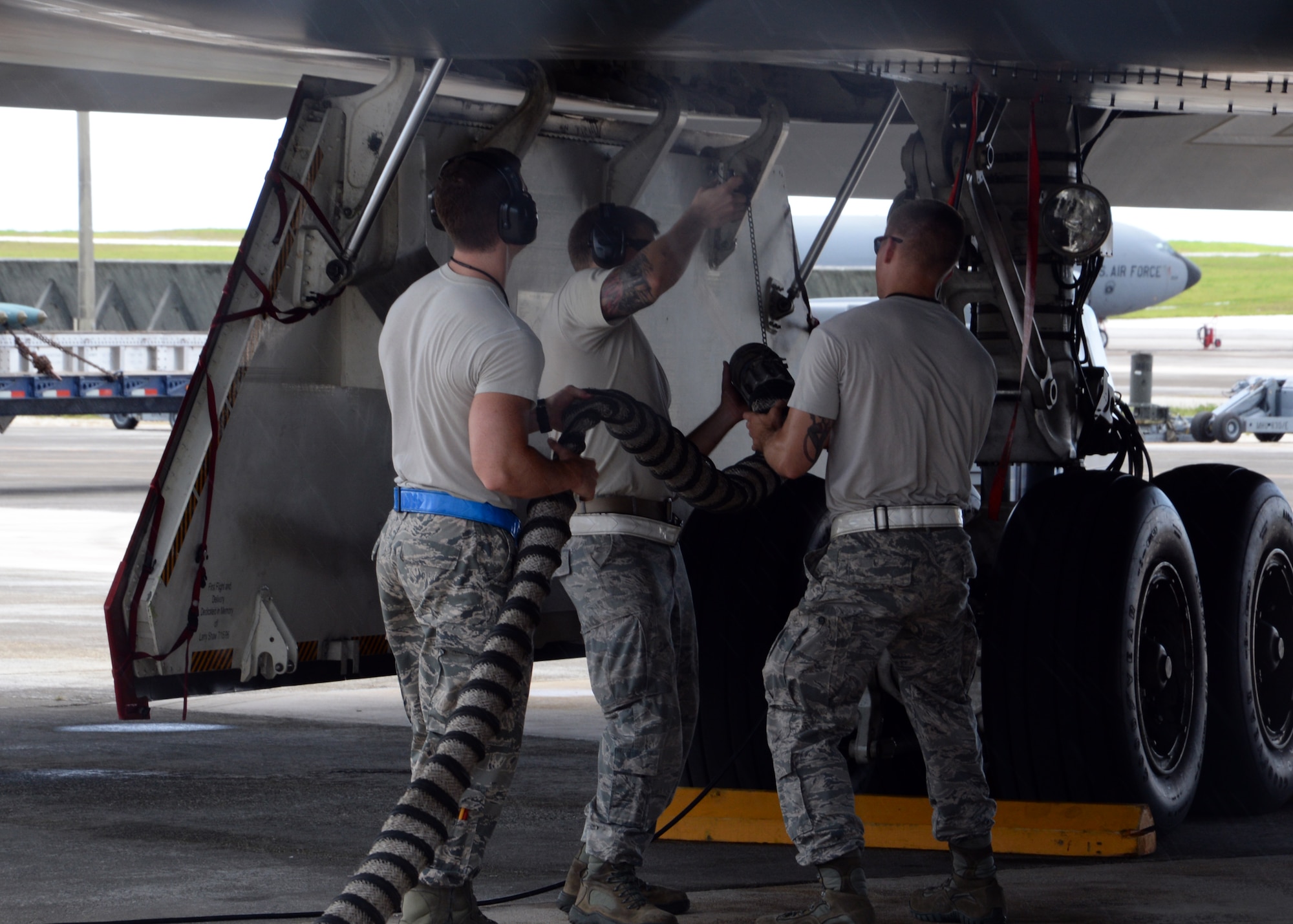 Airmen from the 509th Aircraft Maintenance Squadron work on a B-2 Spirit bomber during a deployment, Andersen Air Force Base, Guam, Aug. 22, 2014.The bombers and approximately 200 support Airmen, assigned to the 509th Bomb Wing at Whiteman Air Force Base, Mo., deployed to Guam Aug. 6, 2014 to improve combat readiness and ensure regional stability.  Bomber deployments help maintain stability in the region while allowing units to become familiar with operating in the theater according to USPACOM.  (U.S. Air Force photo by Senior Airman Cierra Presentado/Released)