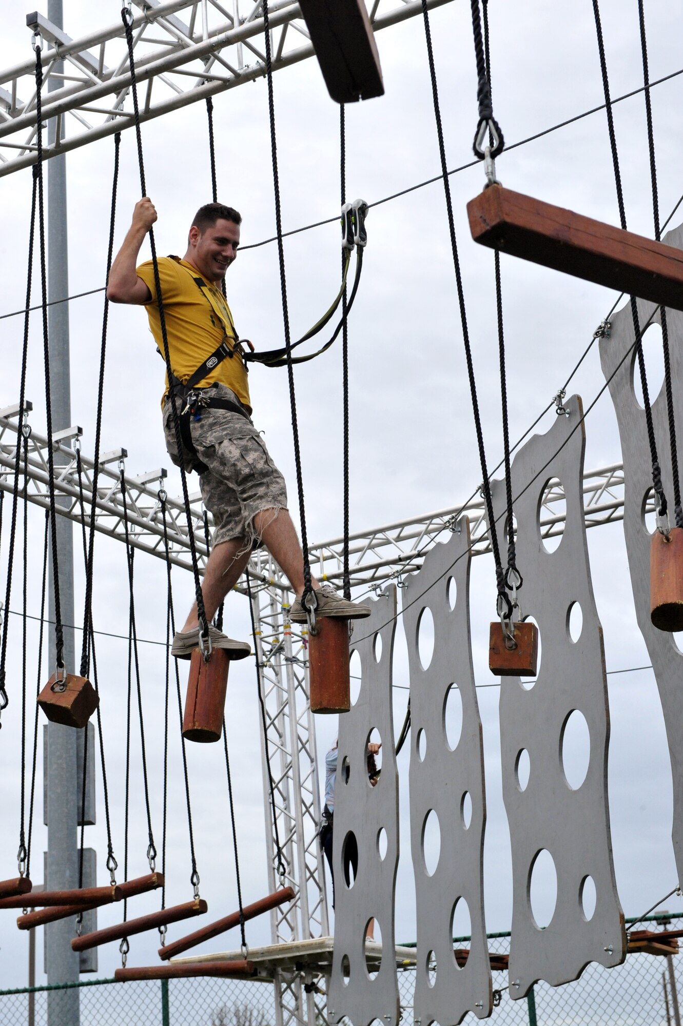 Airman 1st Class James Ramroth, 460th Operations Group satellite technician, balances his way through obstacles during FunFest Aug. 22, 2014 on Buckley Air Force Base, Colo. The 460th Space Wing celebrated its 10th birthday with FunFest, a day filled with sport competitions and a community fair. (U.S. Air Force photo by Airman Emily E. Amyotte/Released)