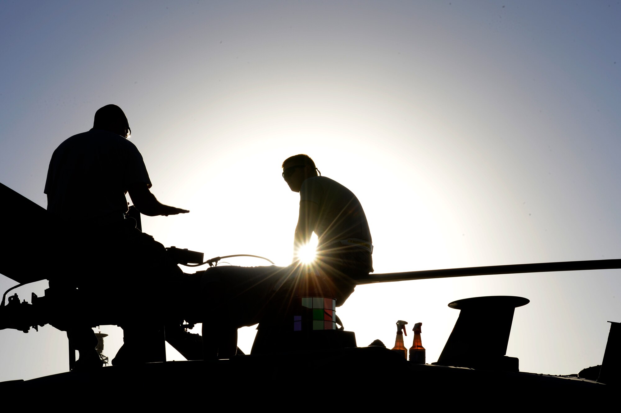 U.S. Air Force Senior Airman Benjamin Martin, Tech. Sgt. Korey Ehinger, and Senior Airman LeSean Young-Dilworth, 455th Expeditionary Aircraft Maintenance Squadron, perform a preflight inspection on a HH-60G Pave Hawk at Bagram Air Field, Afghanistan, July 19, 2014. Martin is a Colorado Springs, Colo. native, Ehinger is a Ft. Wayne, Ind. native, and Young-Dilworth is a Pembroke Pines, Fla. native. All are deployed from the 923rd Aircraft Maintenance Squadron, Davis-Monthan Air Force Base, Ariz. (U.S. Air Force photo by Senior Airman Sandra Welch)