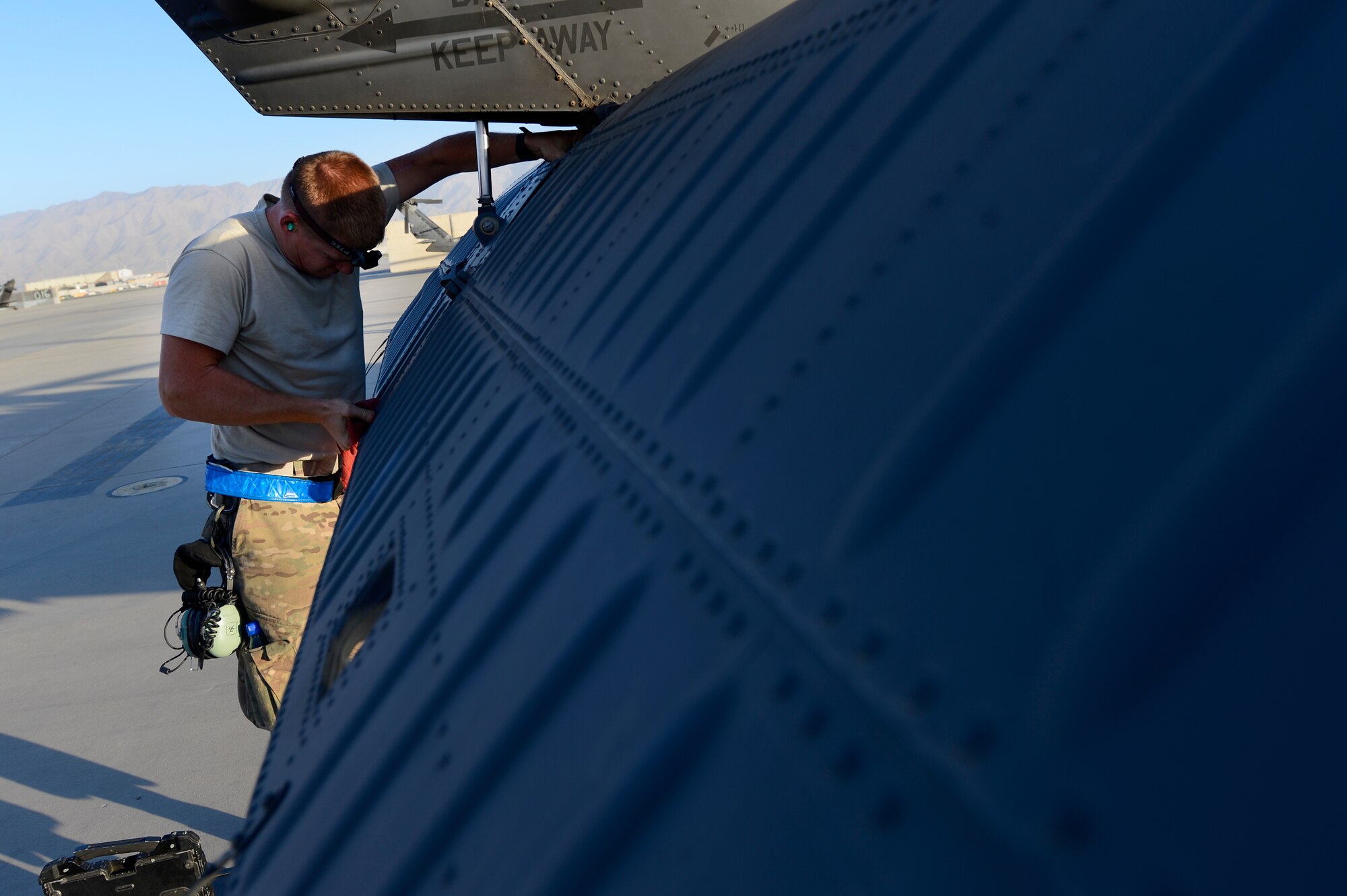 U.S. Air Force Airman 1st Class Daniel Schaetzle, 455th Expeditionary Aircraft Maintenance Squadron crew chief, conducts a preflight inspection on a HH-60G Pave Hawk at Bagram Air Field, Afghanistan, July 19, 2014. The preflight consists of a thorough inspection of the entire aircraft to ensure its capability to perform the mission safely and effectively. Schaetzle is a Hershey, Pa., native deployed from the 923rd Aircraft Maintenance Squadron, Davis-Monthan Air Force Base, Ariz. (U.S. Air Force photo by Senior Airman Sandra Welch)