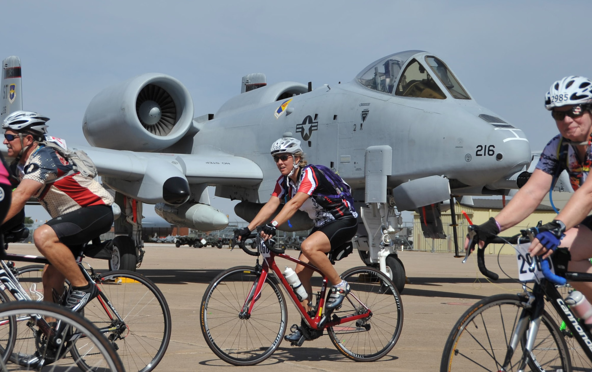 Hotter’N Hell participants cruise through Airpower Alley on Sheppard Air Force Base, Texas, Aug. 23, 2014. Cyclists competing in the Hotter’N Hell bike race passes through Airpower Alley where riders had the opportunity to meet and greet Air Force pilots and take pictures with several different aircraft. (U.S. Air Force photo/Airman 1st Class Robert L. McIlrath)