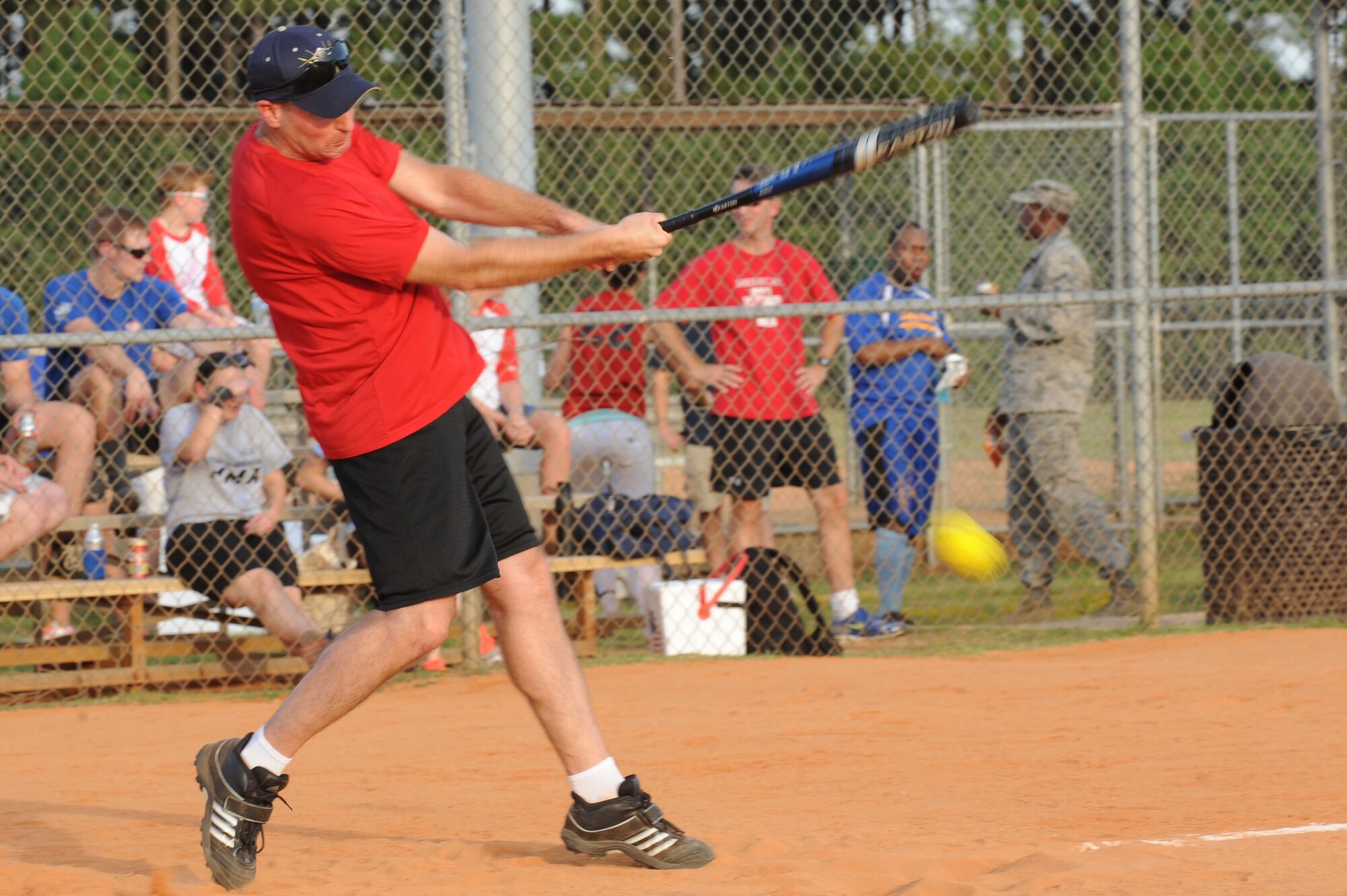 U.S. Air Force Col. Stephen Jost, 20th Fighter Wing commander, hits a ball during a softball game at Shaw Air Force Base, S.C., Aug. 21, 2014. Jost, along with other Team Shaw leaders, played against Shaw’s Chiefs Group during a family fun night event. The “Eagles,” the base leadership team, won the game. (U.S. Air Force photo by Airman 1st Class Michael Cossaboom/Released)