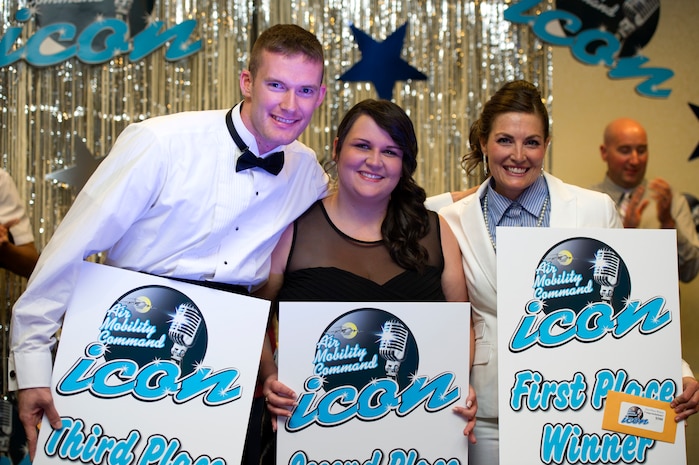 Erin Pope, Ashley Balter and Chad Slayton (from right to left) celebrate winning first, second and third respectively at Joint Base Charleston's AMC Icon competition Aug. 21, 2014, at the Charleston club. Each major installation within AMC is conducting a base-level AMC Icon contest. As the top placing active duty contestant, Slayton will represent JB Charleston in the AMC finals. AMC Icon is held each year to promote morale and healthy competition across the command. (U.S. Air Force photo/Staff Sgt. William O'Brien)