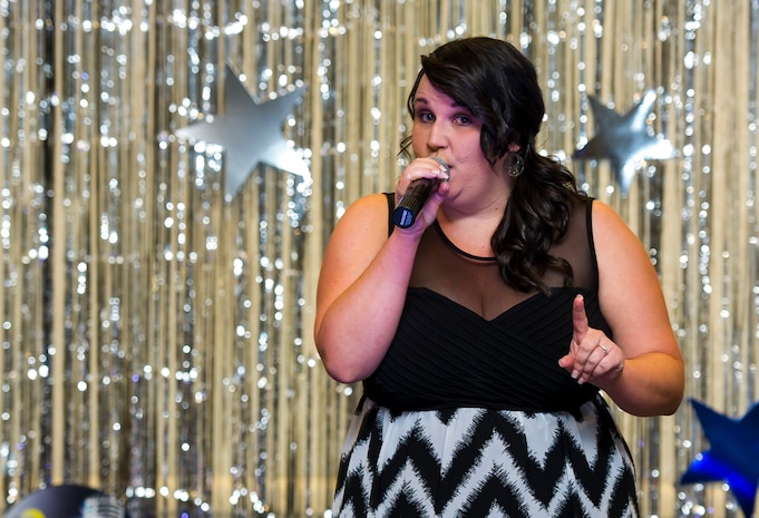 Ashley Balter performs during Joint Base Charleston's AMC Icon competition Aug. 21, 2014, at the Charleston club. Each major installation within AMC is conducting a base-level AMC Icon contest. The top placing active duty contestant from each installation will represent their installation in the AMC finals. AMC Icon is held each year to promote morale and healthy competition across the command. (U.S. Air Force photo/Staff Sgt. William O'Brien)