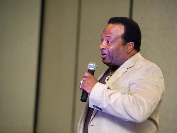 John West performs during Joint Base Charleston's AMC Icon competition Aug. 21, 2014, at the Charleston club. Each major installation within AMC is conducting a base-level AMC Icon contest. The top placing active duty contestant from each installation will represent their installation in the AMC finals. AMC Icon is held each year to promote morale and healthy competition across the command. (U.S. Air Force photo/Staff Sgt. William O'Brien)