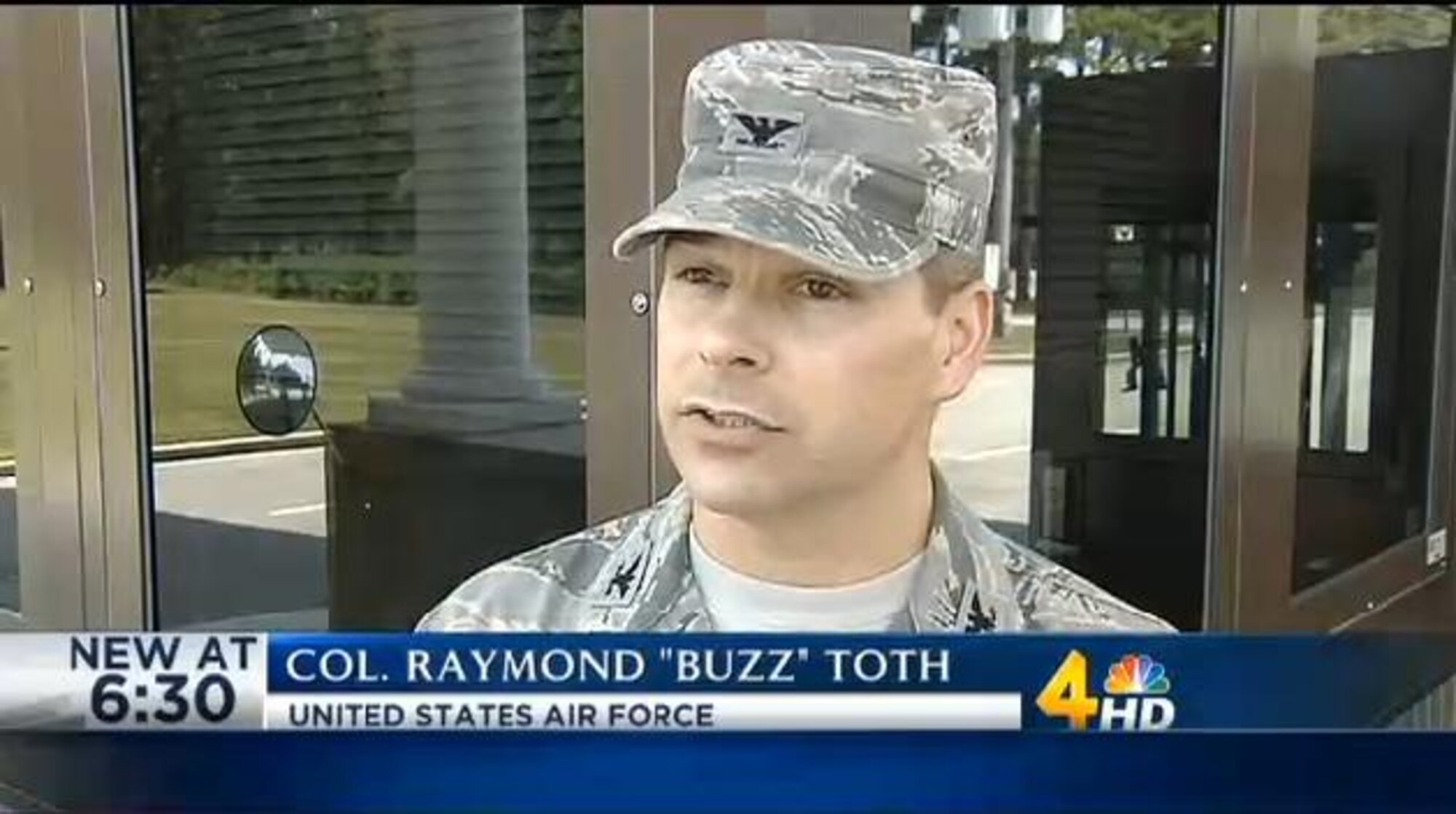 Arnold Engineering Development Complex (AEDC) Commander Col. Raymond Toth speaks with a reporter from Channel 4 News after the mock press conference held as part of the active shooter drill that took place at Arnold Air Force Base on Aug. 4. (WSMV Photo)