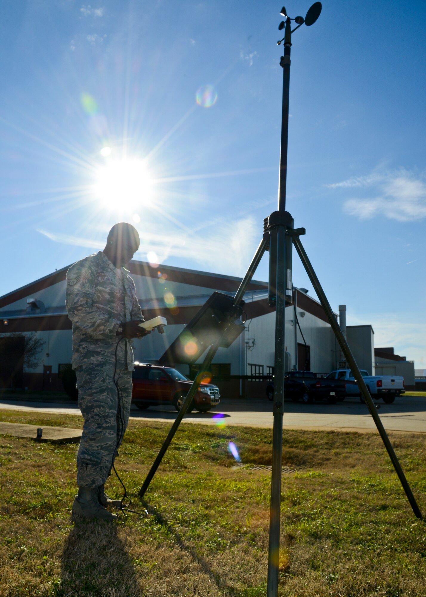 U.S. Air Force Staff Sgt. Andrew Bethea, 1st Operations Support Squadron Weather Operations noncommissioned officer in charge, tests tactical equipment at Langley Air Force Base, Va., Dec. 17, 2013. Weather specialists read and interpret weather satellite imagery, climatology reports, computerized weather prediction models and Doppler weather radar imagery. Bethea hails from Greenville, SC. (U.S. Air Force photo by Airman 1st Class Victoria H. Taylor/ Released)