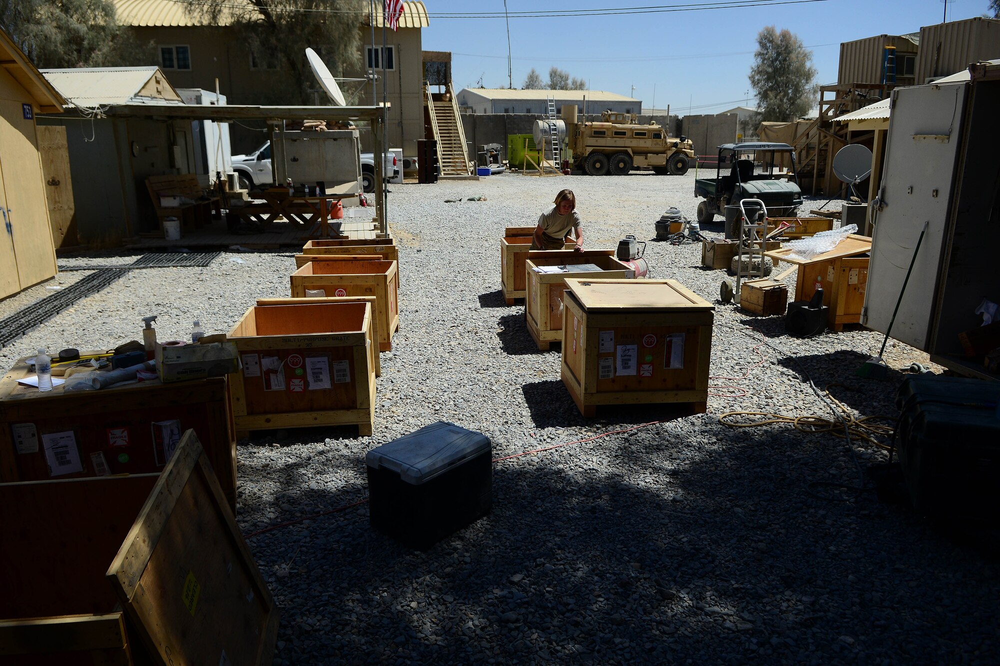 U.S. Air Force Tech Sgt. Sgt. Stacy Trosine, 466th Operating Location Bravo Explosive Ordnance Disposal logistics management non-commissioned officers-in-charge, packs EOD assets at Kandahar Airfield, Afghanistan Aug. 20, 2014. Trosine is helping close down the Air Force EOD unit.  She is responsible for inventorying, disposing, returning and shipping all equipment.  She is deployed from Fairchild Air Force Base, Wash. and a native of Colbert, Wash.  (U.S. Air Force photo by Staff Sgt. Evelyn Chavez/Released)