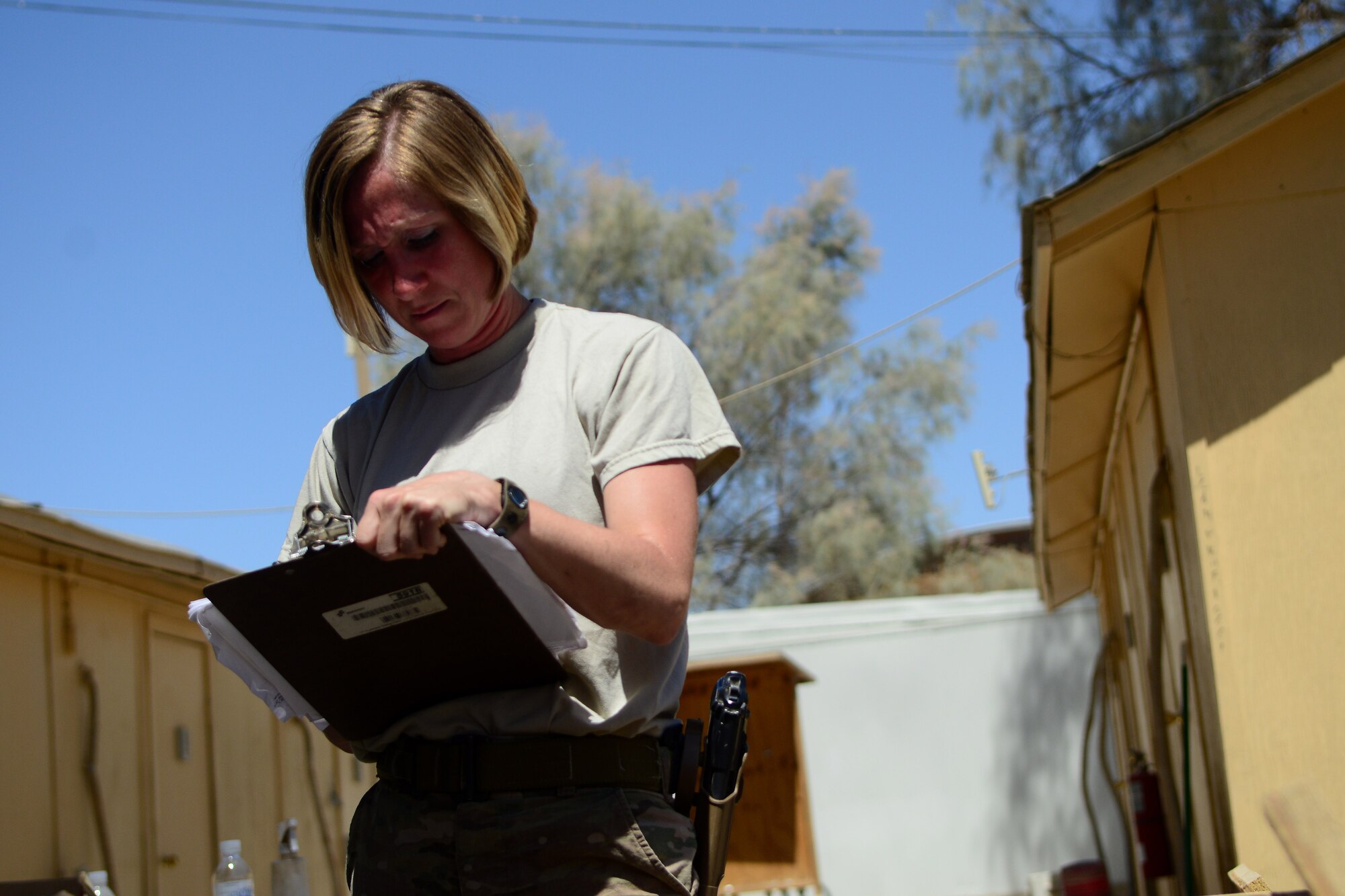 U.S Air Force Tech Sgt. Sgt. Stacy Trosine, 466th Operating Location Bravo Explosive Ordnance Disposal logistics management non-commissioned officer-in-charge, takes inventory of EOD assets at Kandahar Airfield, Afghanistan Aug. 20, 2014. Trosine is helping close down the Air Force EOD unit.  She is responsible for inventorying, disposing, returning and shipping all equipment.  She is deployed from Fairchild Air Force Base, Wash. and a native of Colbert, Wash.  (U.S. Air Force photo by Staff Sgt. Evelyn Chavez/Released)
