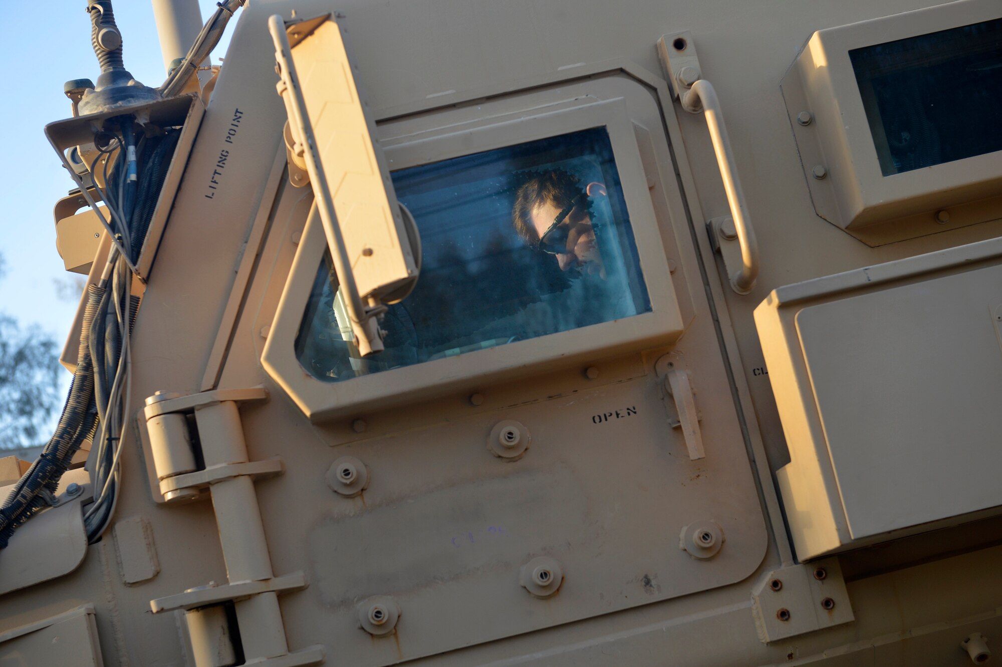 A U.S. Air Force Airman from the 466th Operating Location Bravo Explosive Ordnance Disposal flight prepares to leave for its final mission at Kandahar Airfield, Afghanistan Aug. 19, 2014.  After ten years, the unit completed their final mission in Afghanistan.  The twenty flight rotations have completed more than 10,000 missions in support of Operation Enduring Freedom.  (U.S. Air Force photo by Staff Sgt. Evelyn Chavez/Released)