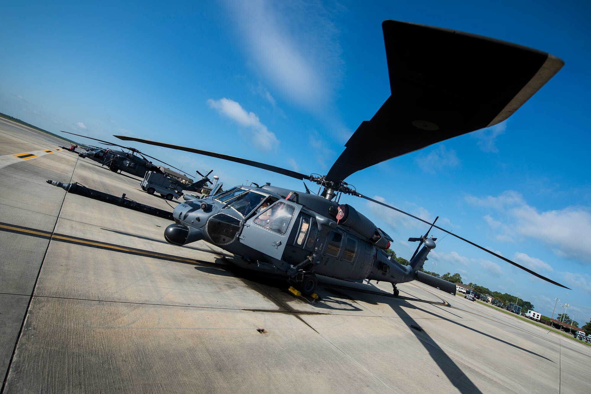 An HH-60G Pave Hawk sits on the flightline at Moody Air Force Base, Ga., Aug. 19, 2014. The primary mission of the HH-60G is to recover isolated personnel from hostile environments. It is also tasked with civil search and rescue, medical evacuation, disaster response and humanitarian assistance. (U.S. Air Force photo by Airman 1st Class Ryan Callaghan/Released)