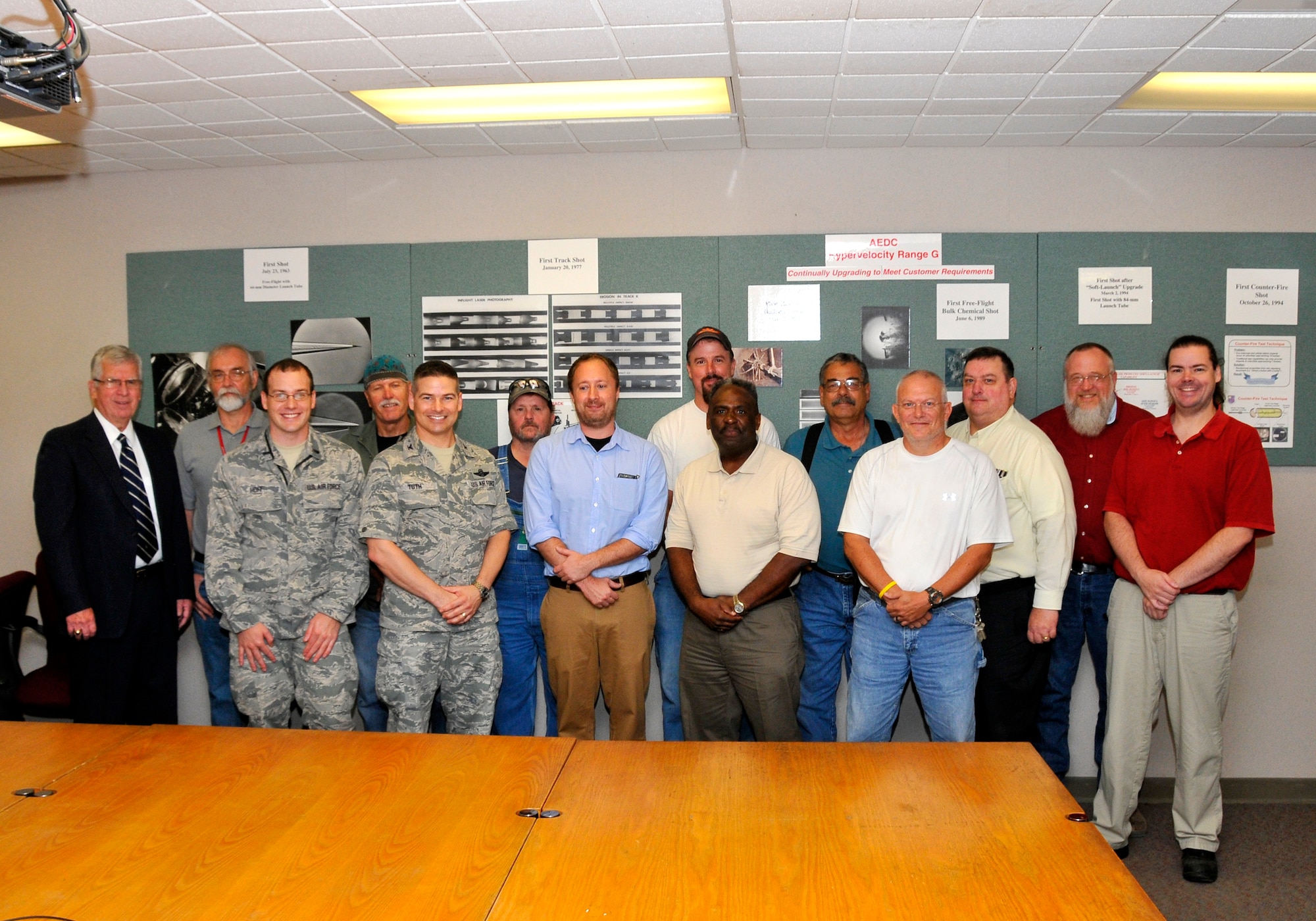 The Arnold Engineering Development Complex (AEDC) DebriSat Team received the Team Excellence recognition from AEDC Chief Technologist Dr. Edward Kraft (far left) and AEDC Commander Col. Raymond Toth (fifth from left) for their support of satellite collision testing. Team members shown here, left to right are Brian Roebuck, 1st Lt. Benjamin Hoff, Randy Hartman, Mark Carson, Marshall Polk, John VanScoten, Mitch Nolen, Richard Howard, Jerry Smith, Ed Erickson, Wayne Whittington and David Woods. Members that were not present include Johnny Bonee, Bing Bragg, Larry Campbell, Bryan Hall, Larry Phipps, Donald Rotach, Charles Trussell and Jason Waller.