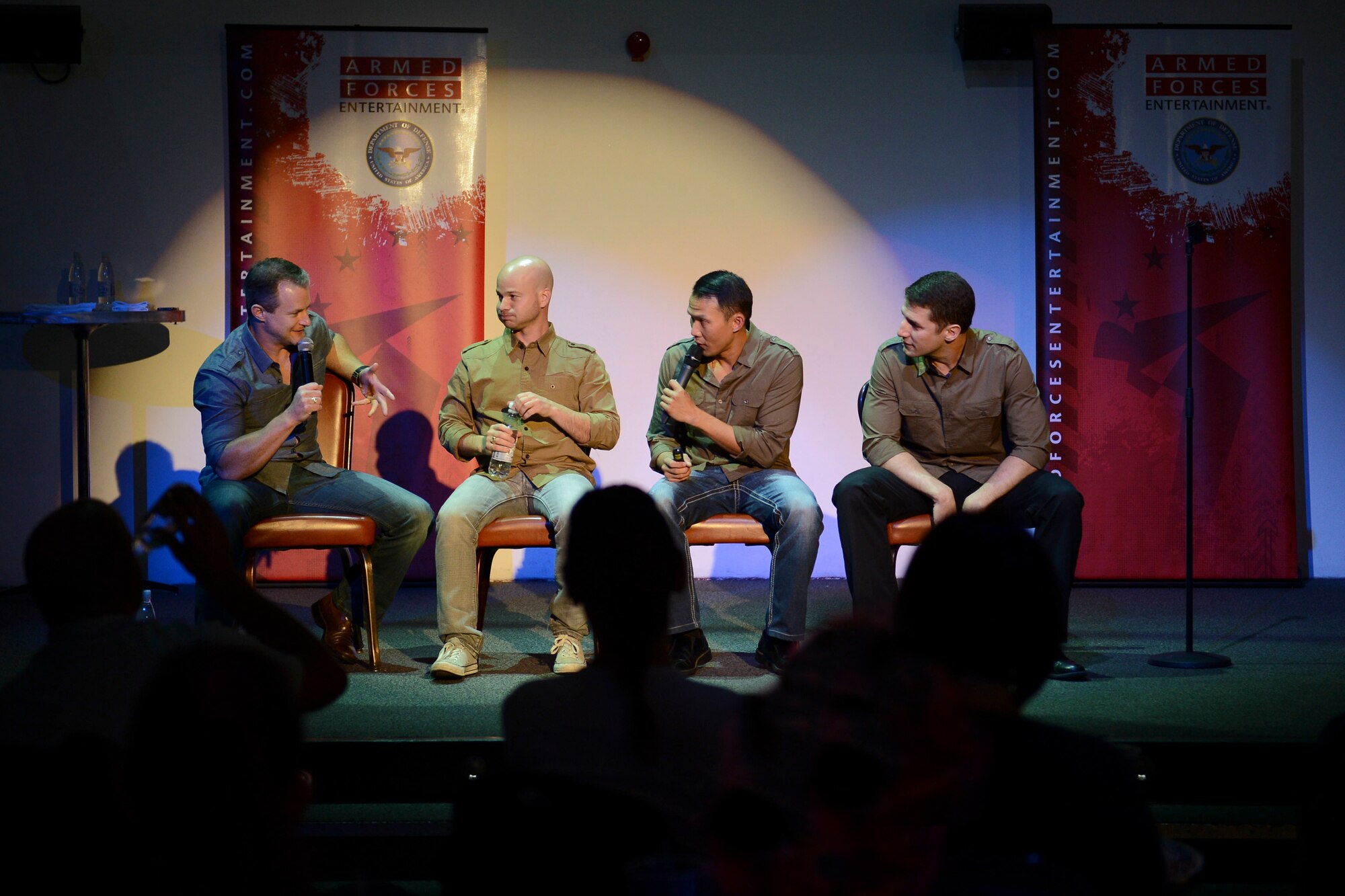 The GIs of Comedy perform a free show at the Enlisted Club, hosted by Armed Forces Entertainment, on Ramstein Air Base, Germany, Aug. 18, 2014. The GIs of Comedy are a group of four stand-up comedians, all combat veterans, who go on tour entertaining service members around the world. (U.S. Air Force photo/Airman 1st Class Michael Stuart)