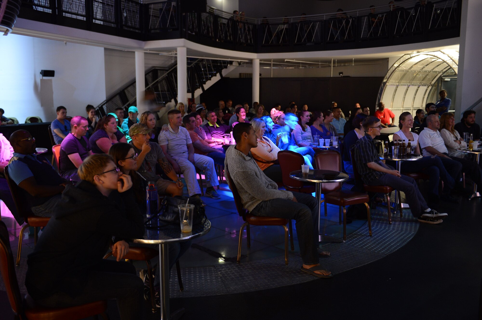 An audience watches the GIs of Comedy show at the Enlisted Club on Ramstein Air Base, Germany, Aug. 18, 2014. The comedy show was a free, 90-minute performance sponsored by Armed Forces Entertainment to boost the morale and entertain service members in the Kaiserslautern Military Community. (U.S. Air Force photo/Airman 1st Class Michael Stuart)