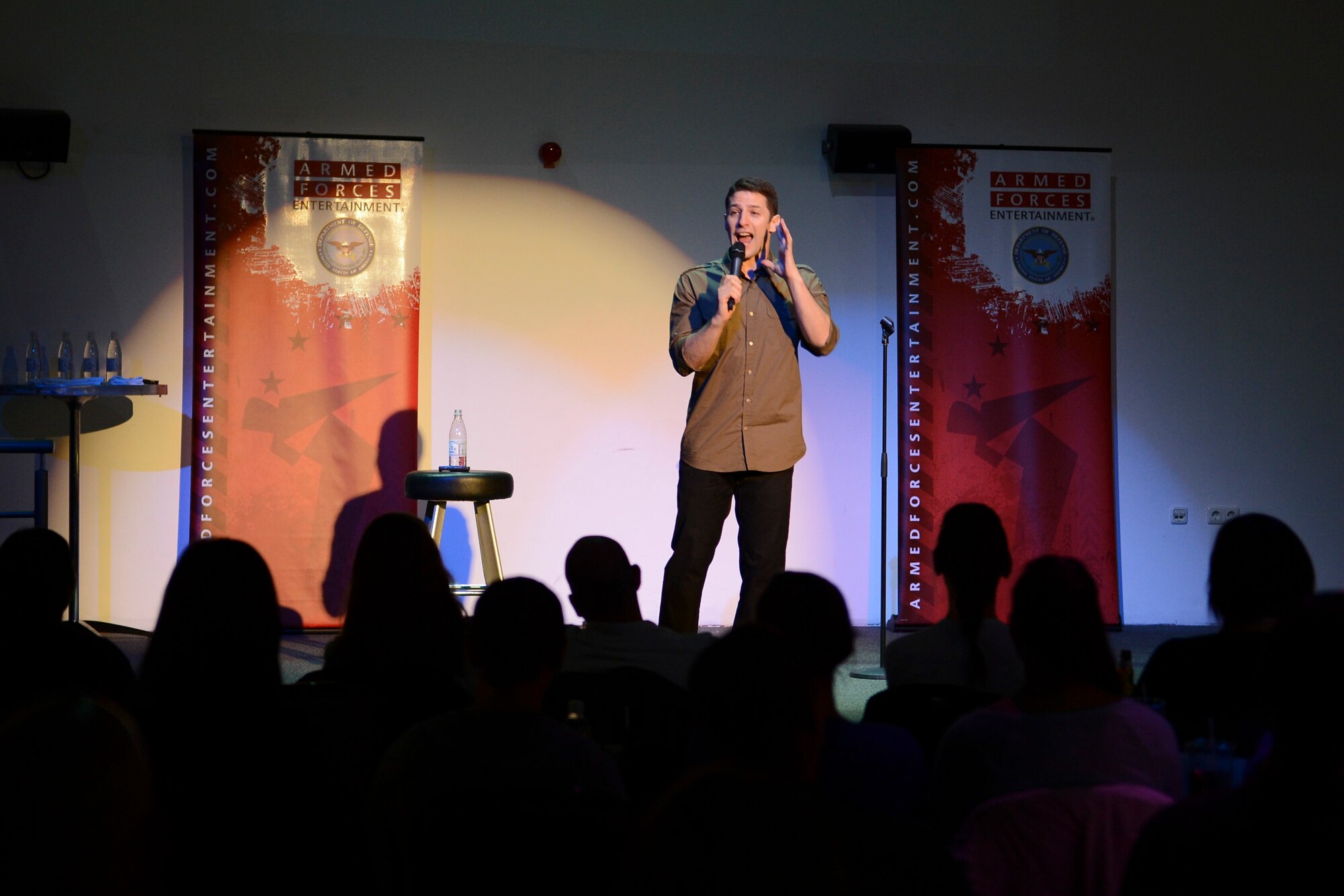 Air Force Reserve Maj., Jose Sarduy, performs on stage during the GIs of Comedy show at the Enlisted Club on Ramstein Air Base, Germany, Aug. 18, 2014. The comedy show was a free, 90-minute performance sponsored by Armed Forces Entertainment to boost the morale and entertain service members in the Kaiserslautern Military Community. (U.S. Air Force photo/Airman 1st Class Michael Stuart)