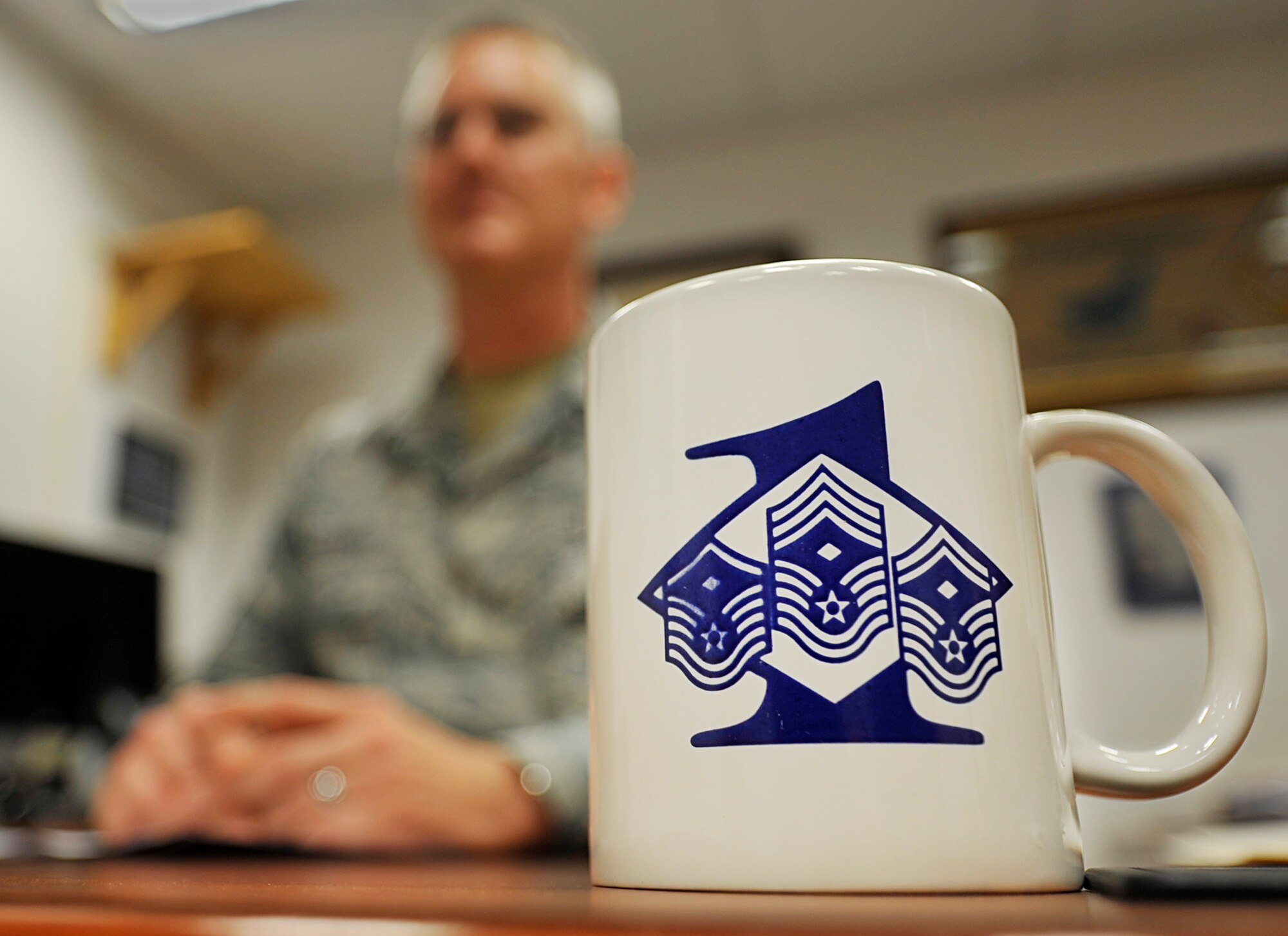 Senior Master Sgt. Keith Custer, 86th Maintenance Squadron first sergeant, speaks with an Airman Aug. 8, 2014, at Ramstein Air Base, Germany. Custer has 10 years of first sergeant experience between 10 different units. Military members make up less than one percent of the population, and first sergeants make up an even smaller percentage. (U.S. Air Force photo/Airman Larissa Greatwood)