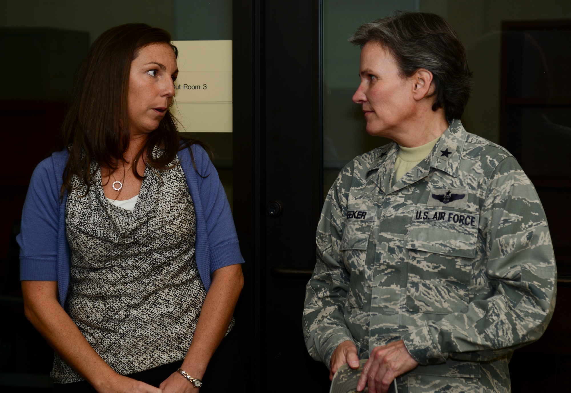 Sarah Winberry, 628th Civil Engineer Squadron installation emergency manager, talks with Brig. Gen. Martha Meeker Aug. 21, 2014, at the emergency operations center on Joint Base Charleston, S.C. Meeker was the 628th Air Base Wing commander from January 2010 to July 2011 and has been the vice commander of the U.S. Air Force Expeditionary Center from July 2012 to present. (U.S. Air Force photo/Airman 1st Class Clayton Cupit)
