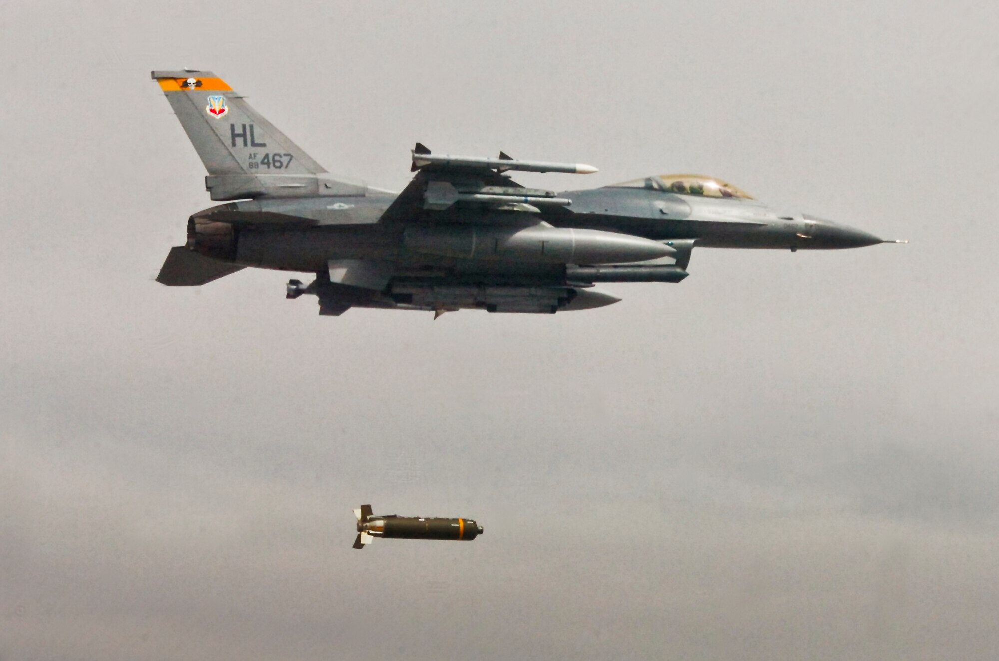 A 4th Fighter Squadron F-16 Fighting Falcon drops a cluster bomb unit-105 during the first week of the weapons system evaluation program that took place at Hill Air Force Base, Utah.  WSEP is an annual training exercise where the effectiveness, maintainability, suitability and accuracy of guided munitions are evaluated.  The program, also known as Combat Archer and Combat Hammer, is managed by the 53rd Weapons Evaluation Group.  The WEG is a geographically separated unit of the 53rd Wing, headquartered at Eglin Air Force Base, Fla.  (Courtesy photo)