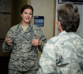 Lt. Col. Meredith Moore, 628th Medical Group chief of medical staff, talks with Brig. Gen. Martha Meeker Aug. 21, 2014, at the 628th MDG on Joint Base Charleston, S.C. Meeker was the 628th Air Base Wing commander from January 2010 to July 2011 and has been the vice commander of the U.S. Air Force Expeditionary Center from July 2012 to present. (U.S. Air Force photo/Airman 1st Class Clayton Cupit)
