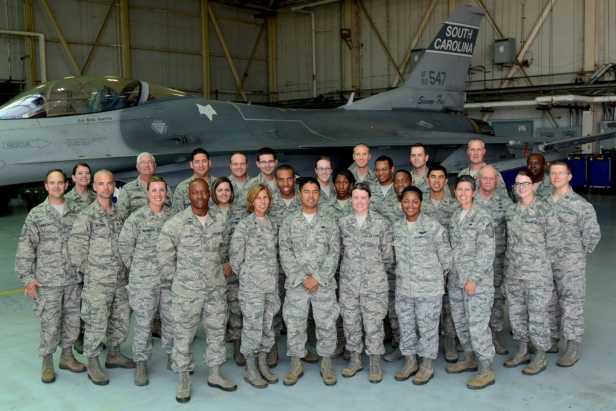 U.S. Air Force Chaplain Candidates visit the South Carolina Air National Guard F-16 hangar during a tour at McEntire Joint National Guard Base, S.C., July 30, 2014. The tour is part of training for the Candidates to be exposed to various ministry missions at active duty, guard and reserve Air Force bases.  (U.S. Air National Guard photo by Tech. Sgt. Caycee Watson/Released)