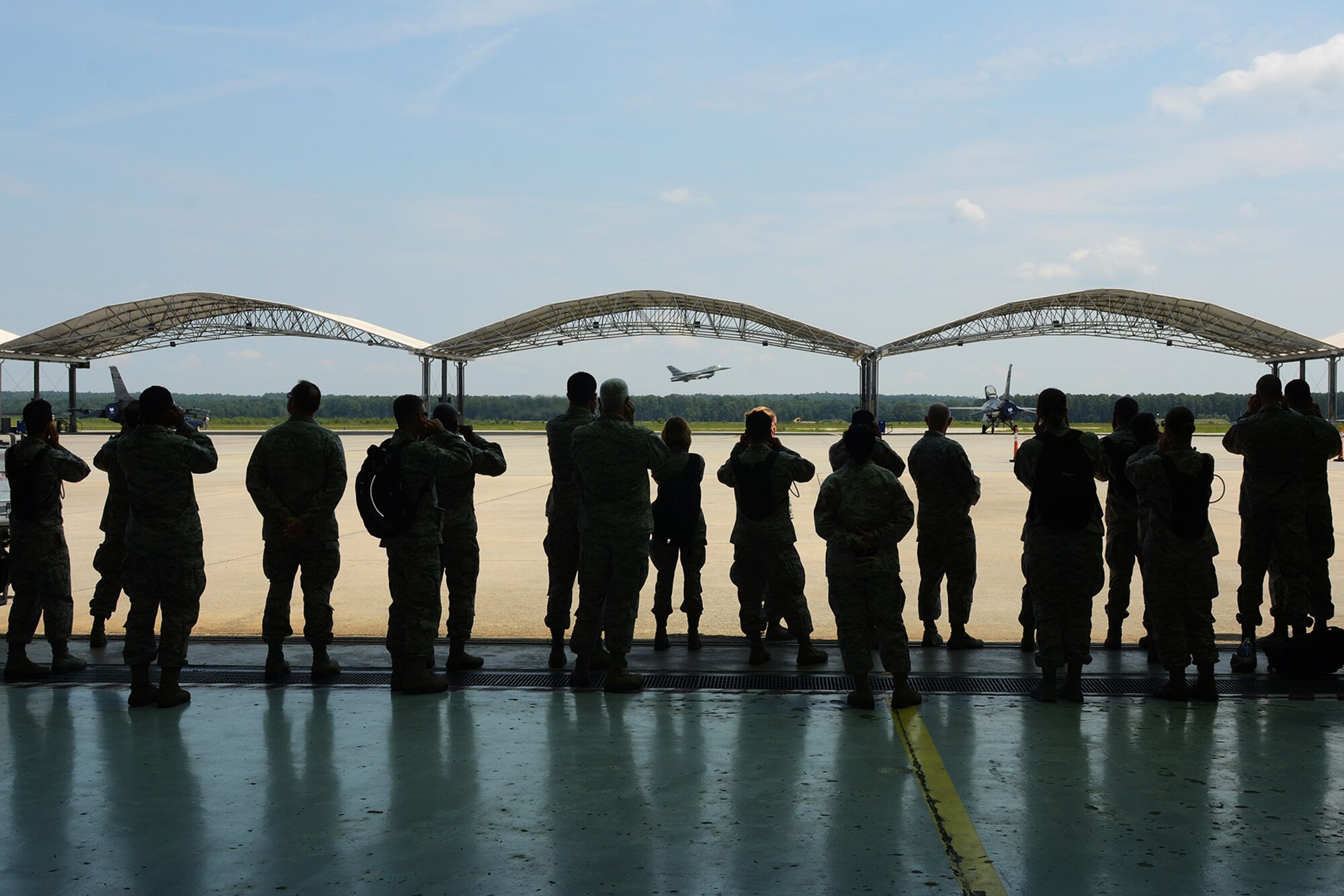 U.S. Air Force Chaplain Candidates visit the South Carolina Air National Guard F-16 hangar during a tour at McEntire Joint National Guard Base, S.C., July 30, 2014. The tour is part of training for the Candidates to be exposed to various ministry missions at active duty, guard and reserve Air Force bases.  (U.S. Air National Guard photo by Tech. Sgt. Caycee Watson/Released)