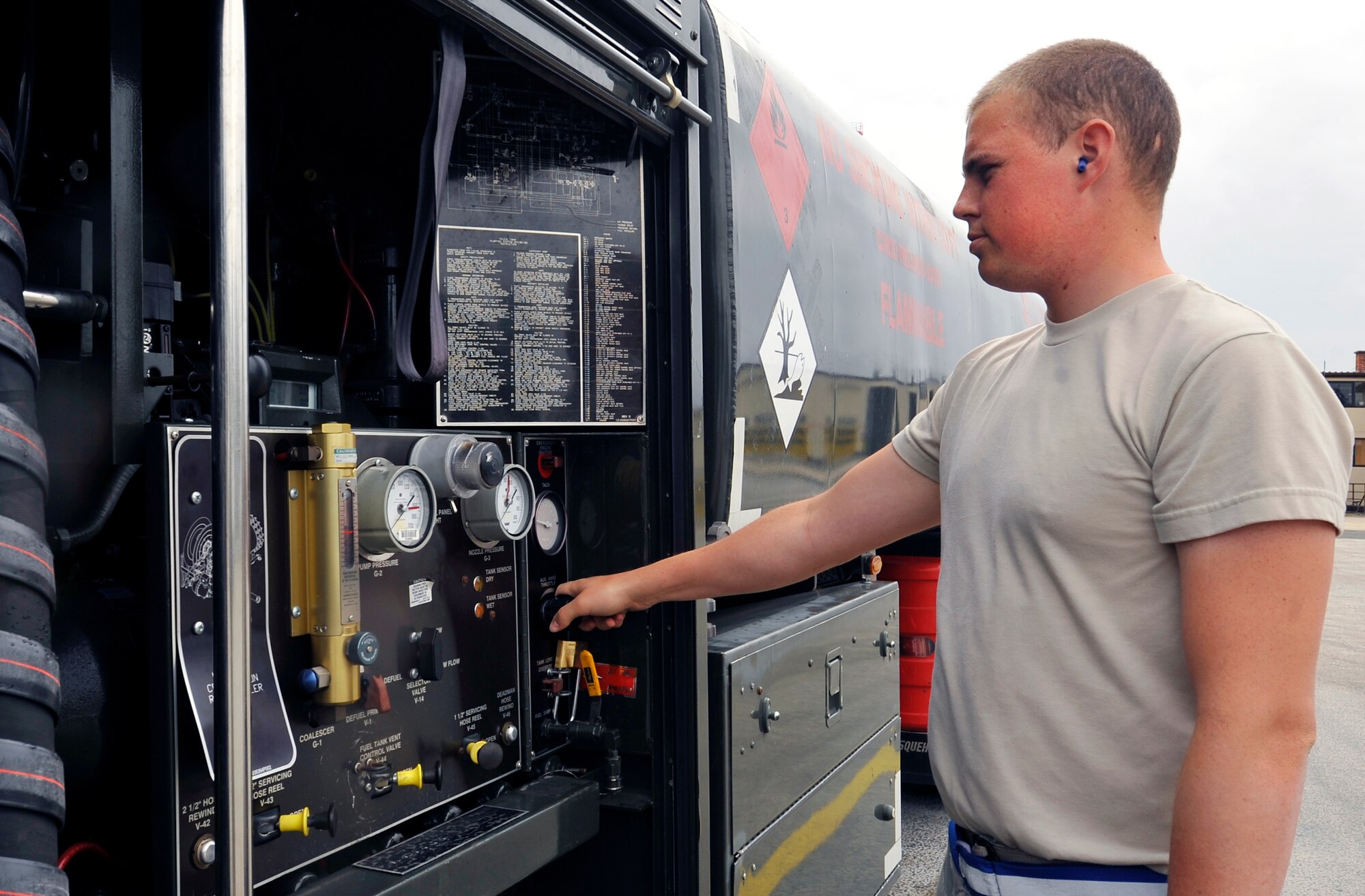 Airman 1st Class Ben Hunter, 86th Logistics Readiness Squadron fuel distribution operator, checks pressure gauges on a fuel truck, Aug. 18, 2014 at Ramstein Air Base, Germany. Hunter reached his goal of pumping one million gallons of fuel in July. An Airman has not been able to pump that amount of fuel in a single month at Ramstein in two years. (U.S. Air Force photo/Airman Larissa Greatwood)