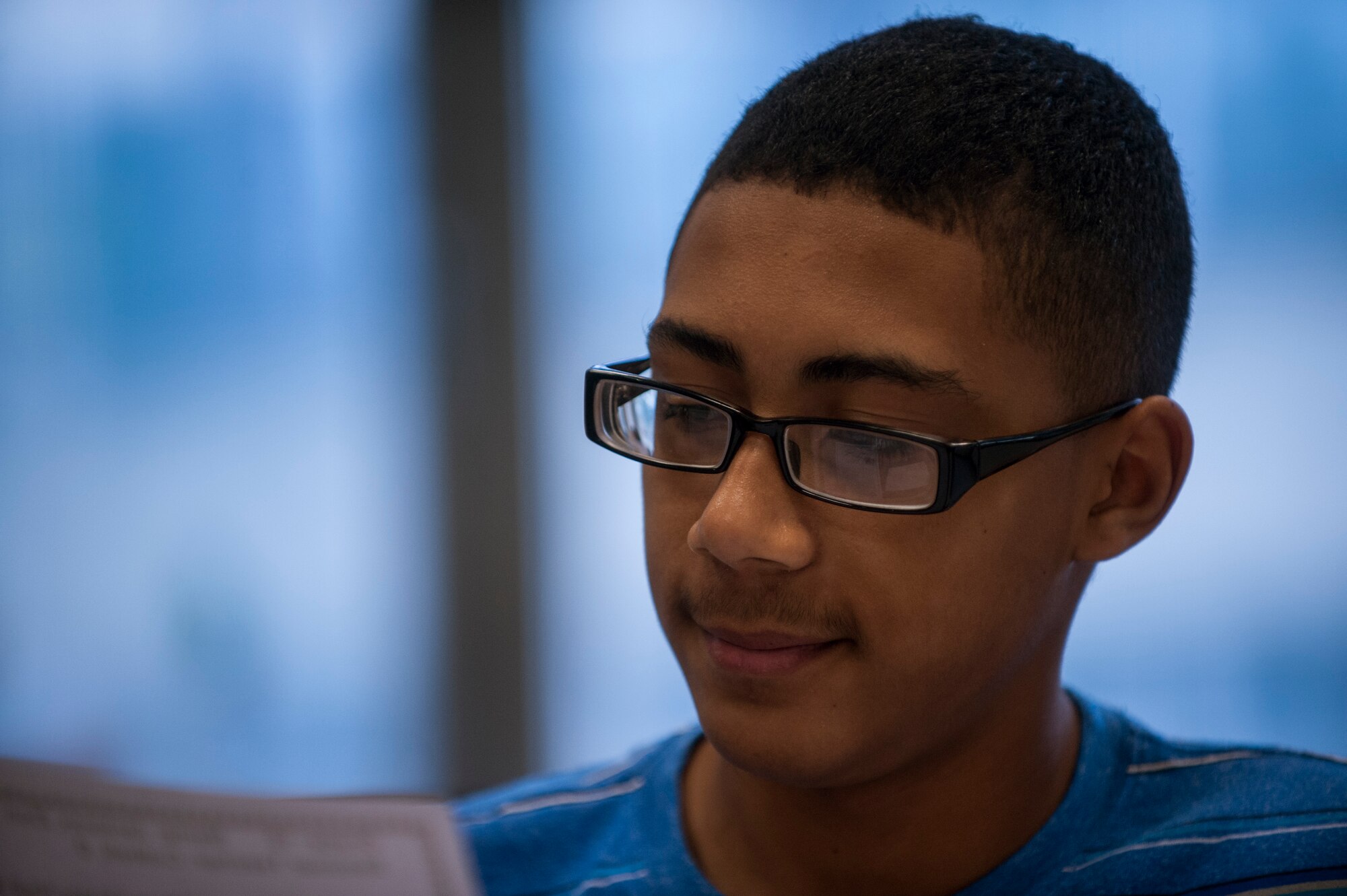 Zion Jackson, a student at Bitburg Middle-High School, looks at a schedule during the first day of school Aug. 25, 2014, at Bitburg Annex, Germany. The school has more than 240 students and 30 faculty members. (U.S. Air Force photo by Senior Airman Rusty Frank/Released)