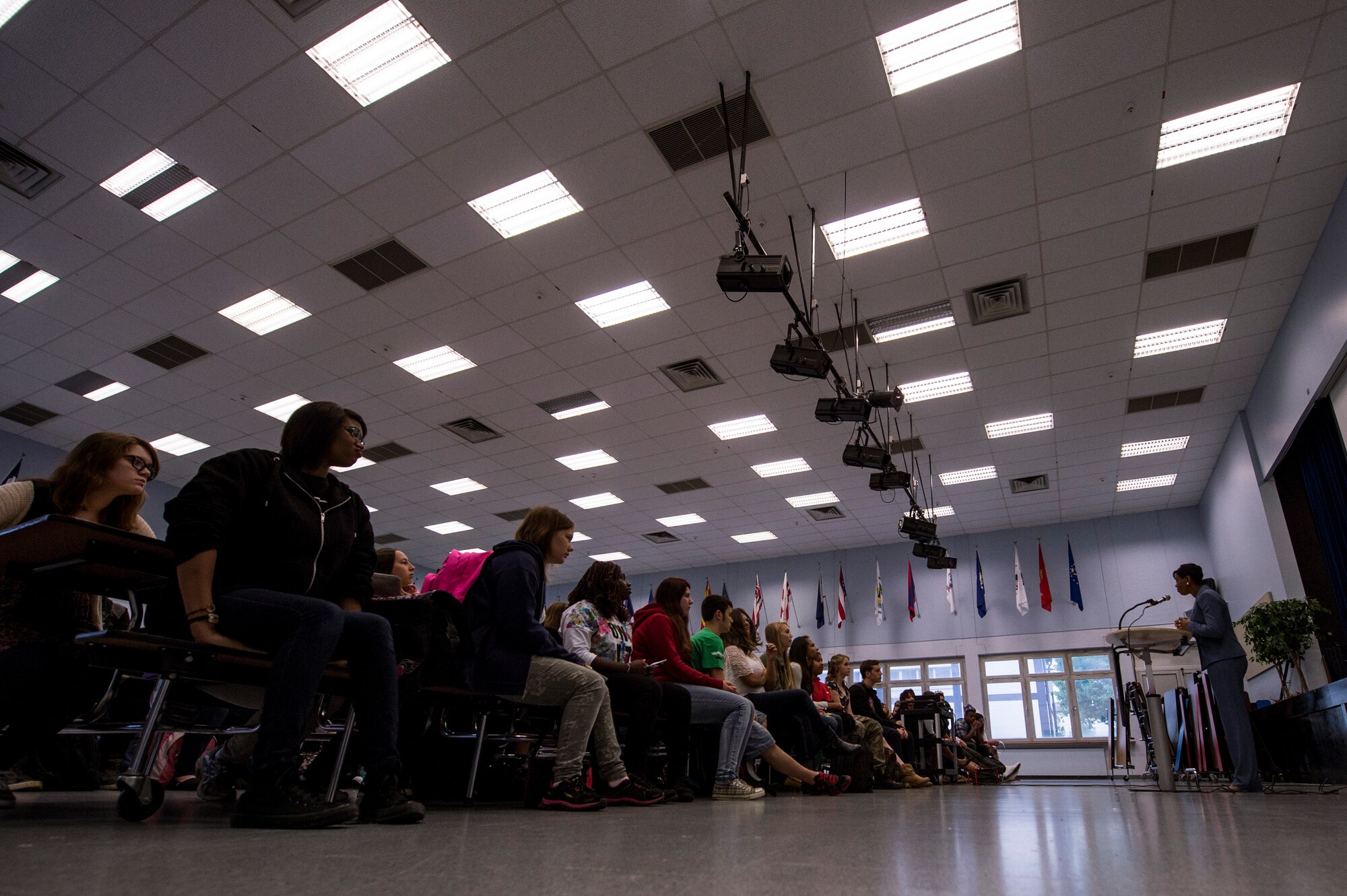 Kaawa Fulton, Bitburg Middle-High School vice principal, addresses the student body during the first day of school Aug. 25, 2014, at Bitburg Annex, Germany. During the briefing, students received expectations for the 2014-2015 school year and met the new principal. (U.S. Air Force photo by Senior Airman Rusty Frank/Released)
